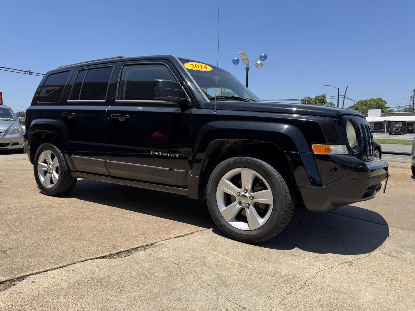 2014 BLACK /Gray JEEP PATRIOT LATITUDE Latitude 4dr SUV (1C4NJPFA7ED) with an 2.0L I4 engine, CVT transmission, located at 5900 E. Lancaster Ave., Fort Worth, TX, 76112, (817) 457-5456, 0.000000, 0.000000 - This is a 2014 Jeep Patriot Latitude 4dr SUV that is in excellent condition. There are no dents or scratches. The interior is clean with no rips or tears or stains. All power windows, door locks and seats. Ice cold AC for those hot Texas summer days. It is equipped with a CD player, AM/FM radio, AUX - Photo#2