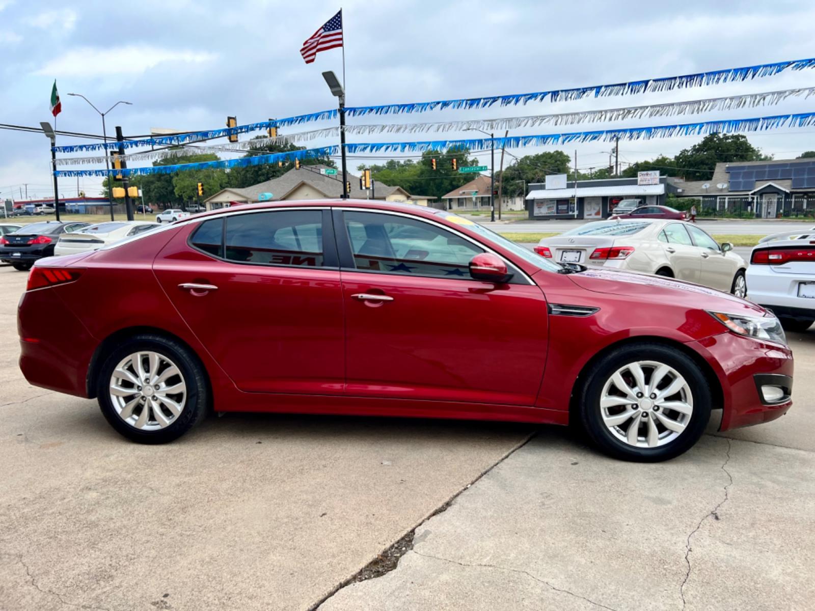 2015 RED KIA OPTIMA EX; LX (5XXGN4A73FG) , located at 5900 E. Lancaster Ave., Fort Worth, TX, 76112, (817) 457-5456, 0.000000, 0.000000 - This is a 2015 KIA OPTIMA EX 4 DR SEDAN that is in excellent condition. There are no dents or scratches. The interior is clean with no rips or tears or stains. All power windows, door locks and seats. Ice cold AC for those hot Texas summer days. It is equipped with a CD player, AM/FM radio, AUX port - Photo #7