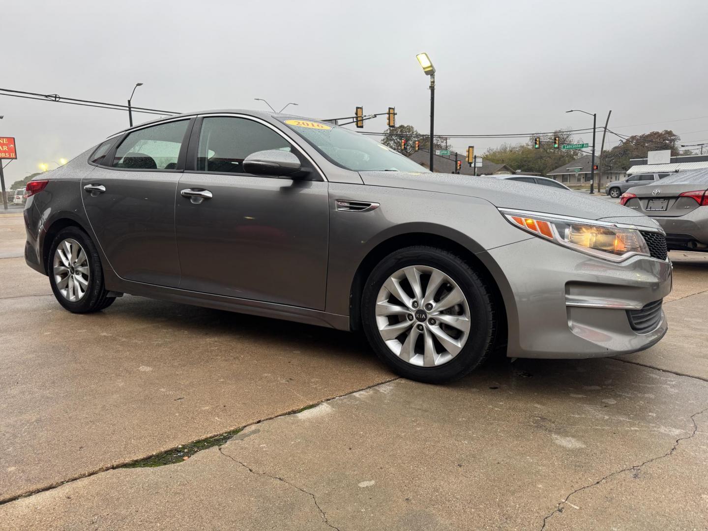 2016 GRAY KIA OPTIMA (5XXGT4L35GG) , located at 5900 E. Lancaster Ave., Fort Worth, TX, 76112, (817) 457-5456, 0.000000, 0.000000 - This is a 2016 KIA OPTIMA 4 DR SEDAN that is in excellent condition. The interior is clean with no rips or tears or stains. All power windows, door locks and seats. Ice cold AC for those hot Texas summer days. It is equipped with a CD player, AM/FM radio, AUX port, Bluetooth connectivity and Sirius - Photo#3