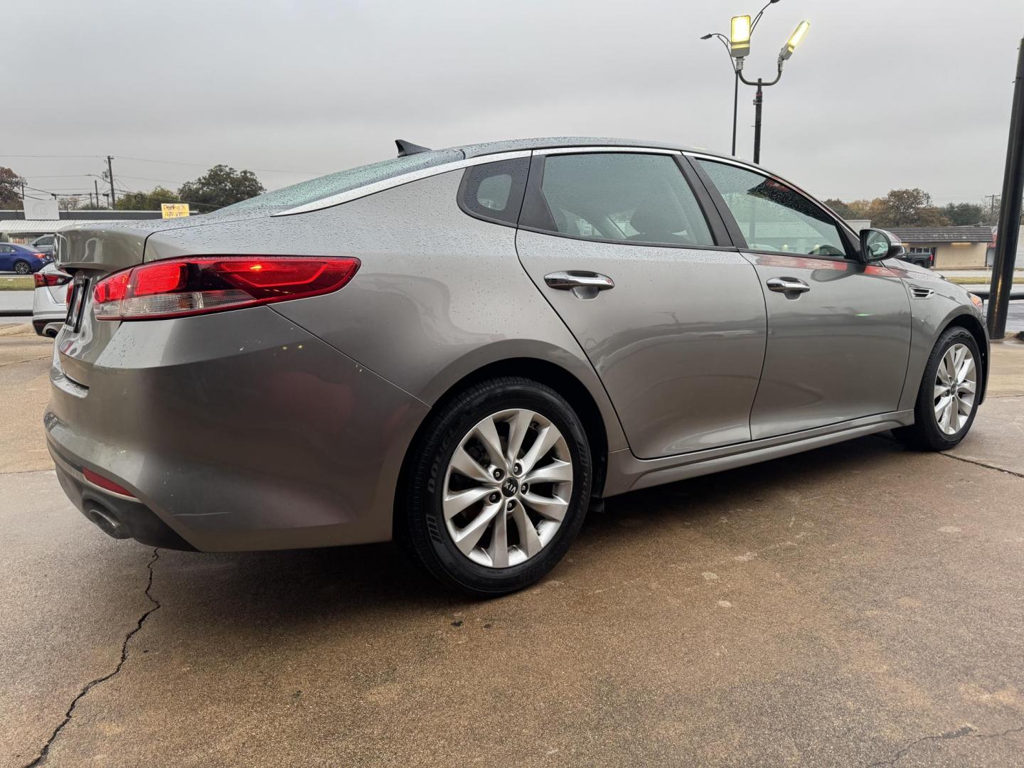 2016 GRAY KIA OPTIMA (5XXGT4L35GG) , located at 5900 E. Lancaster Ave., Fort Worth, TX, 76112, (817) 457-5456, 0.000000, 0.000000 - This is a 2016 KIA OPTIMA 4 DR SEDAN that is in excellent condition. The interior is clean with no rips or tears or stains. All power windows, door locks and seats. Ice cold AC for those hot Texas summer days. It is equipped with a CD player, AM/FM radio, AUX port, Bluetooth connectivity and Sirius - Photo#4