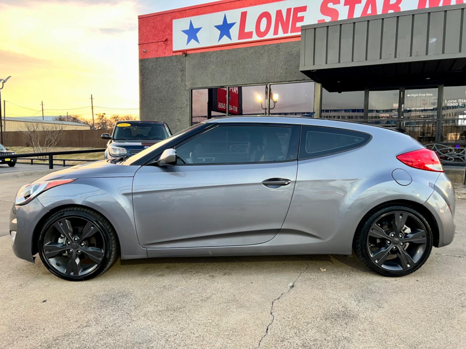 2016 GRAY /Black HYUNDAI VELOSTER Base 3dr Coupe (KMHTC6AD2GU) with an 1.6L I4 engine, Automatic 6-Speed transmission, located at 5900 E. Lancaster Ave., Fort Worth, TX, 76112, (817) 457-5456, 0.000000, 0.000000 - This is a 2016 HYUNDAI VELOSTER 4 DR SEDAN that is in excellent condition. The interior is clean with no rips or tears or stains. All power windows, door locks and seats. Ice cold AC for those hot Texas summer days. It is equipped with a CD player, AM/FM radio, AUX port, Bluetooth connectivity and S - Photo #2