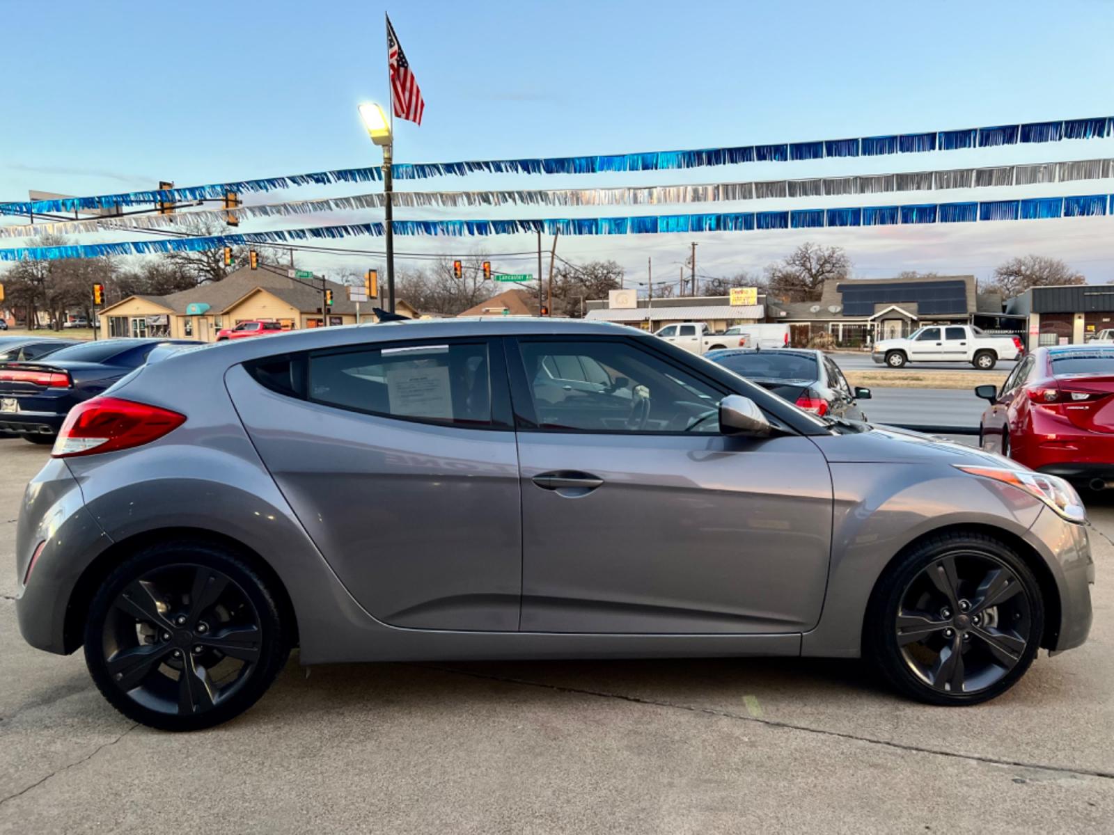2016 GRAY /Black HYUNDAI VELOSTER Base 3dr Coupe (KMHTC6AD2GU) with an 1.6L I4 engine, Automatic 6-Speed transmission, located at 5900 E. Lancaster Ave., Fort Worth, TX, 76112, (817) 457-5456, 0.000000, 0.000000 - This is a 2016 HYUNDAI VELOSTER 4 DR SEDAN that is in excellent condition. The interior is clean with no rips or tears or stains. All power windows, door locks and seats. Ice cold AC for those hot Texas summer days. It is equipped with a CD player, AM/FM radio, AUX port, Bluetooth connectivity and S - Photo #6