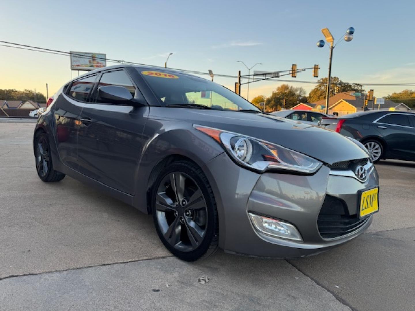 2016 GRAY /Black HYUNDAI VELOSTER Base 3dr Coupe (KMHTC6AD2GU) with an 1.6L I4 engine, Automatic 6-Speed transmission, located at 5900 E. Lancaster Ave., Fort Worth, TX, 76112, (817) 457-5456, 0.000000, 0.000000 - This is a 2016 HYUNDAI VELOSTER 4 DR SEDAN that is in excellent condition. The interior is clean with no rips or tears or stains. All power windows, door locks and seats. Ice cold AC for those hot Texas summer days. It is equipped with a CD player, AM/FM radio, AUX port, Bluetooth connectivity and S - Photo#2