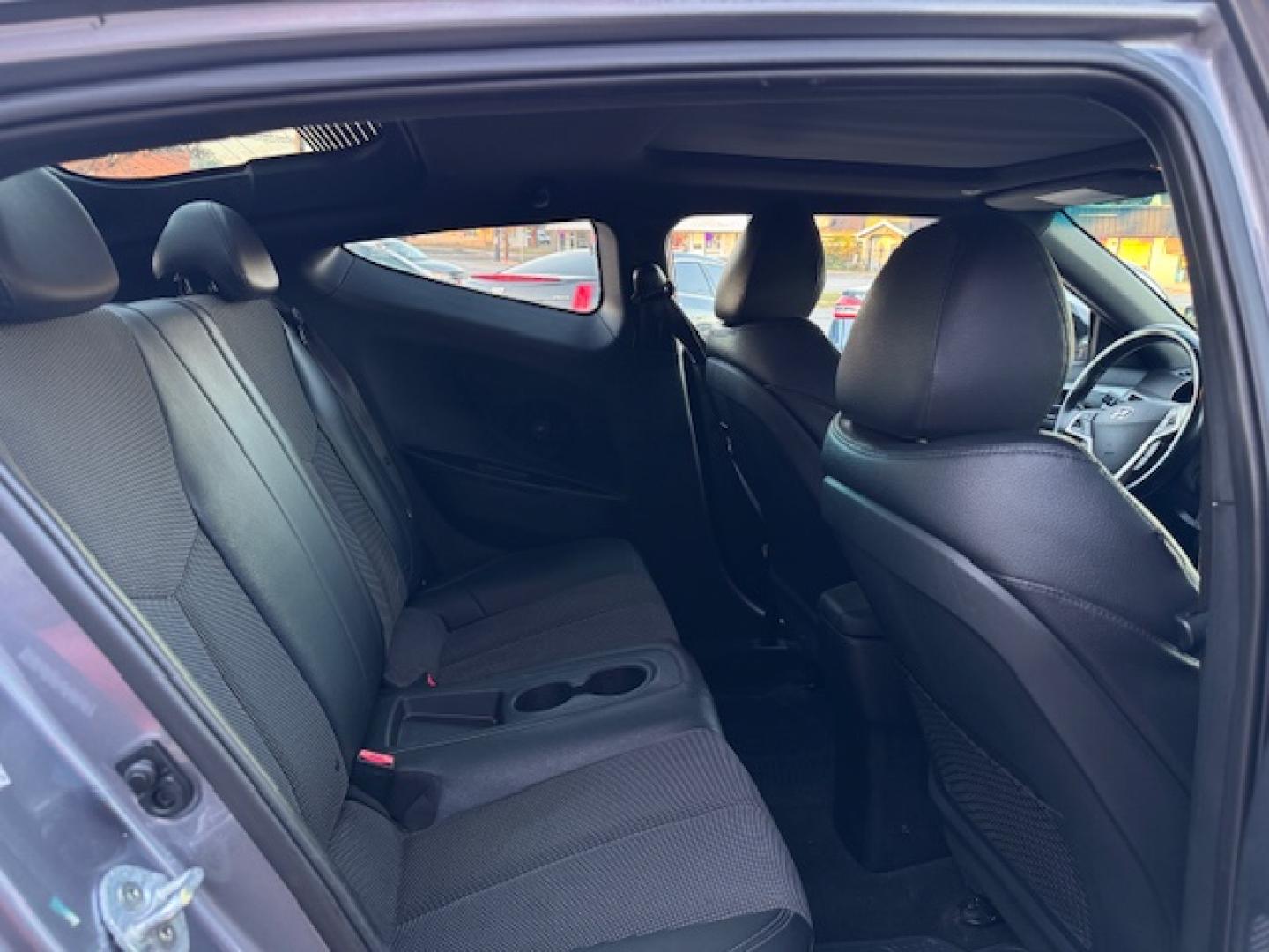 2016 GRAY /Black HYUNDAI VELOSTER Base 3dr Coupe (KMHTC6AD2GU) with an 1.6L I4 engine, Automatic 6-Speed transmission, located at 5900 E. Lancaster Ave., Fort Worth, TX, 76112, (817) 457-5456, 0.000000, 0.000000 - This is a 2016 HYUNDAI VELOSTER 4 DR SEDAN that is in excellent condition. The interior is clean with no rips or tears or stains. All power windows, door locks and seats. Ice cold AC for those hot Texas summer days. It is equipped with a CD player, AM/FM radio, AUX port, Bluetooth connectivity and S - Photo#12