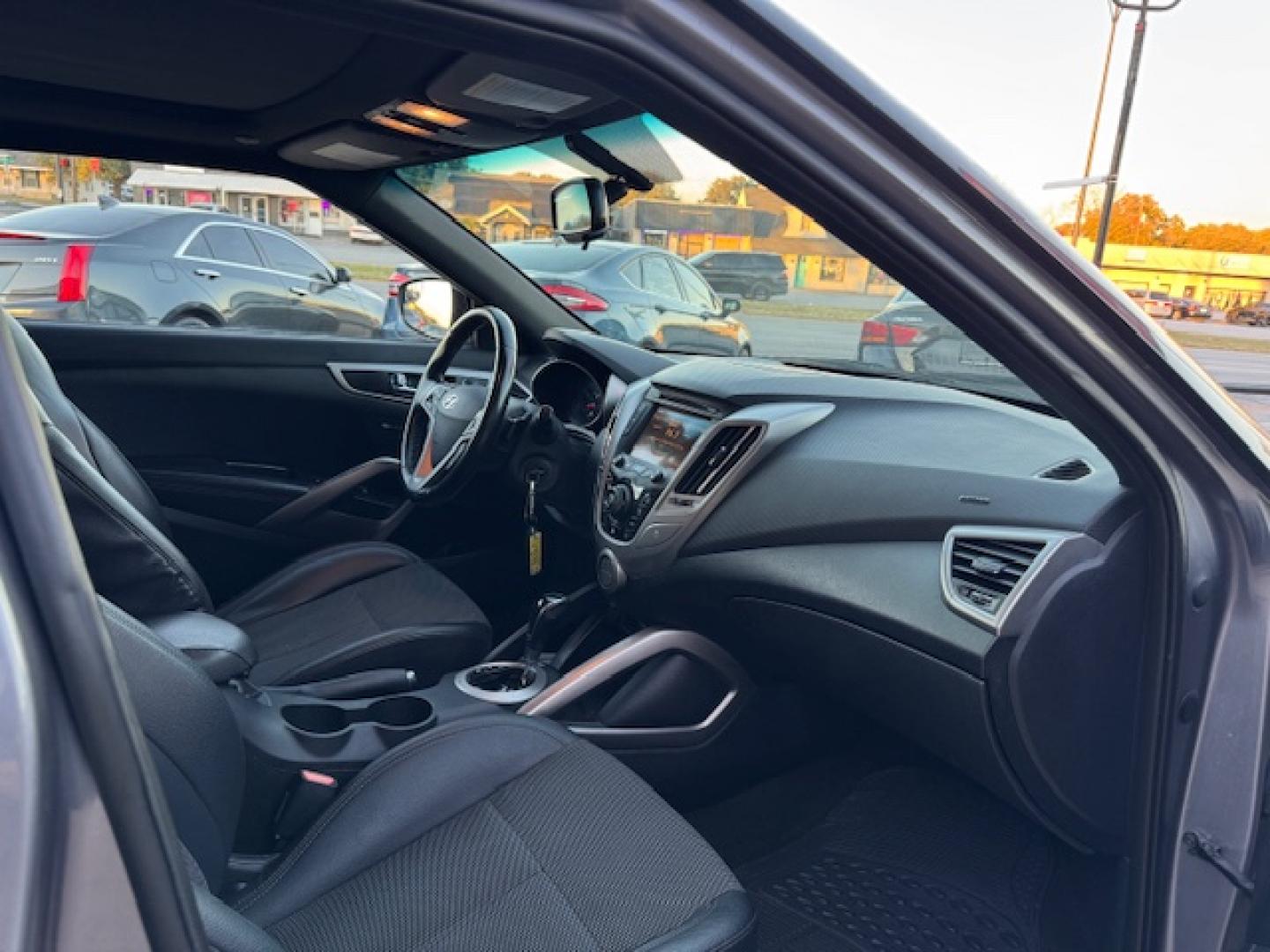 2016 GRAY /Black HYUNDAI VELOSTER Base 3dr Coupe (KMHTC6AD2GU) with an 1.6L I4 engine, Automatic 6-Speed transmission, located at 5900 E. Lancaster Ave., Fort Worth, TX, 76112, (817) 457-5456, 0.000000, 0.000000 - This is a 2016 HYUNDAI VELOSTER 4 DR SEDAN that is in excellent condition. The interior is clean with no rips or tears or stains. All power windows, door locks and seats. Ice cold AC for those hot Texas summer days. It is equipped with a CD player, AM/FM radio, AUX port, Bluetooth connectivity and S - Photo#17