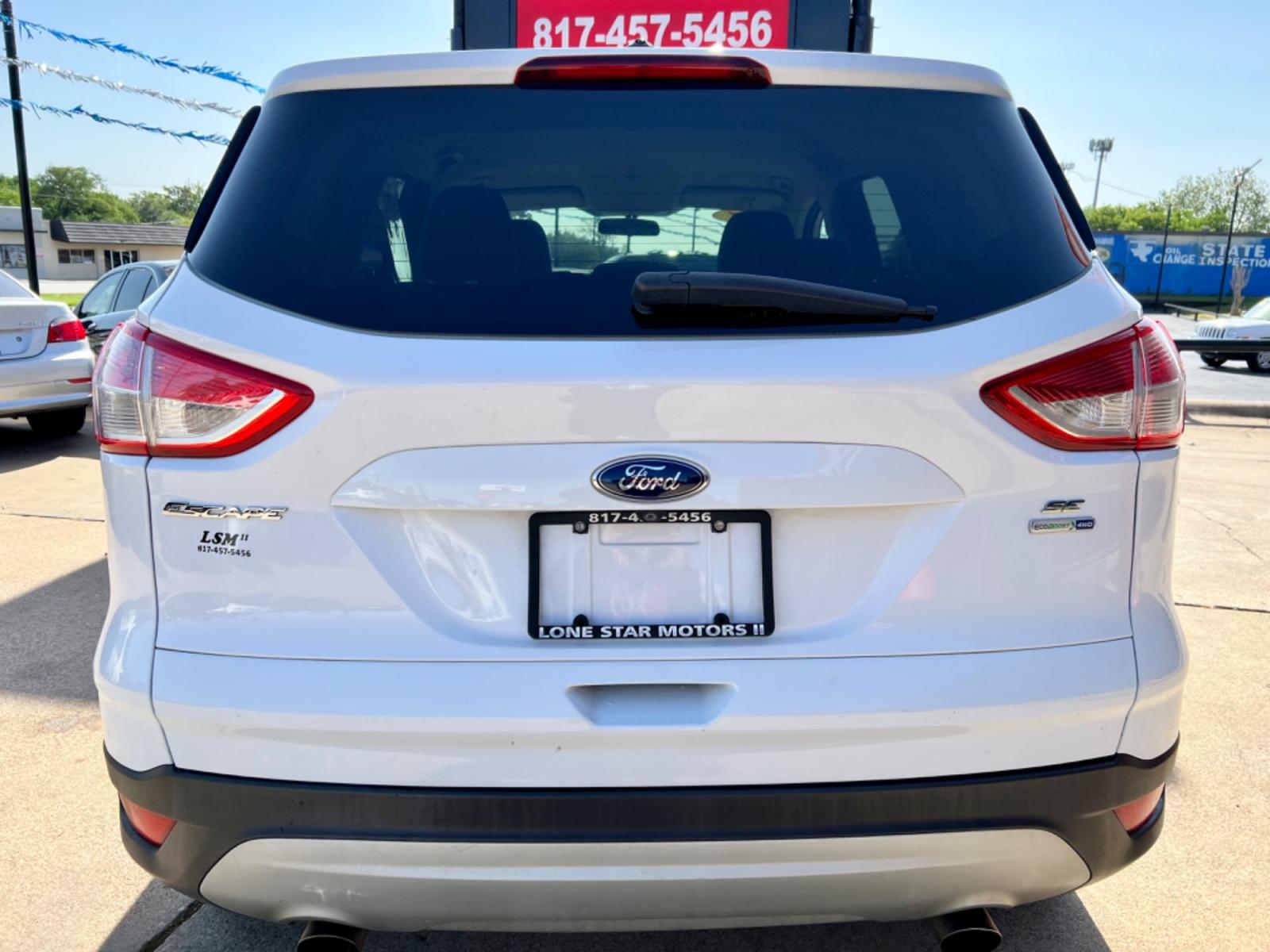 2014 WHITE FORD ESCAPE (1FMCU9GX7EU) , located at 5900 E. Lancaster Ave., Fort Worth, TX, 76112, (817) 457-5456, 0.000000, 0.000000 - This is a 2014 FORD ESCAPE SPORT UTILITY 4-DR that is in excellent condition. There are no dents or scratches. The interior is clean with no rips or tears or stains. All power windows, door locks and seats. Ice cold AC for those hot Texas summer days. It is equipped with a CD player, AM/FM radio, AU - Photo #4