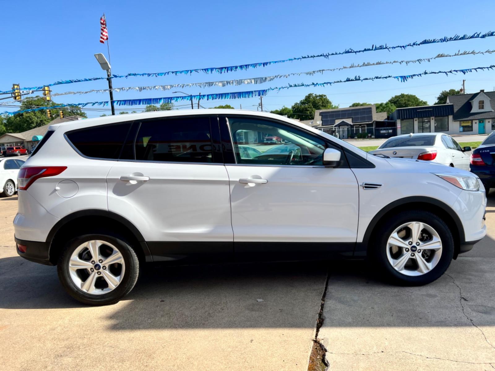 2014 WHITE FORD ESCAPE (1FMCU9GX7EU) , located at 5900 E. Lancaster Ave., Fort Worth, TX, 76112, (817) 457-5456, 0.000000, 0.000000 - This is a 2014 FORD ESCAPE SPORT UTILITY 4-DR that is in excellent condition. There are no dents or scratches. The interior is clean with no rips or tears or stains. All power windows, door locks and seats. Ice cold AC for those hot Texas summer days. It is equipped with a CD player, AM/FM radio, AU - Photo #6
