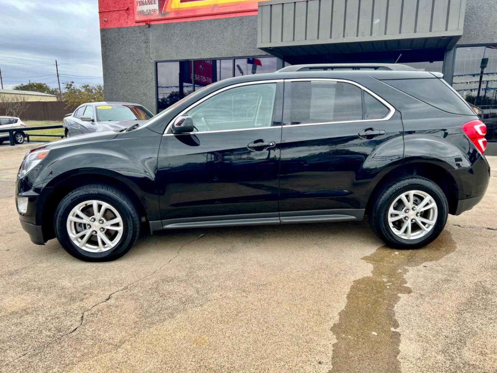 2017 BLACK /Gray CHEVROLET EQUINOX LT 4dr SUV w/1LT (2GNALCEK0H6) with an 2.4L I4 engine, Automatic 6-Speed transmission, located at 5900 E. Lancaster Ave., Fort Worth, TX, 76112, (817) 457-5456, 0.000000, 0.000000 - This is a 2017 Chevrolet Equinox LT 4dr SUV w/1LT that is in excellent condition. There are no dents or scratches. The interior is clean with no rips or tears or stains. All power windows, door locks and seats. Ice cold AC for those hot Texas summer days. It is equipped with a CD player, AM/FM radio - Photo #2