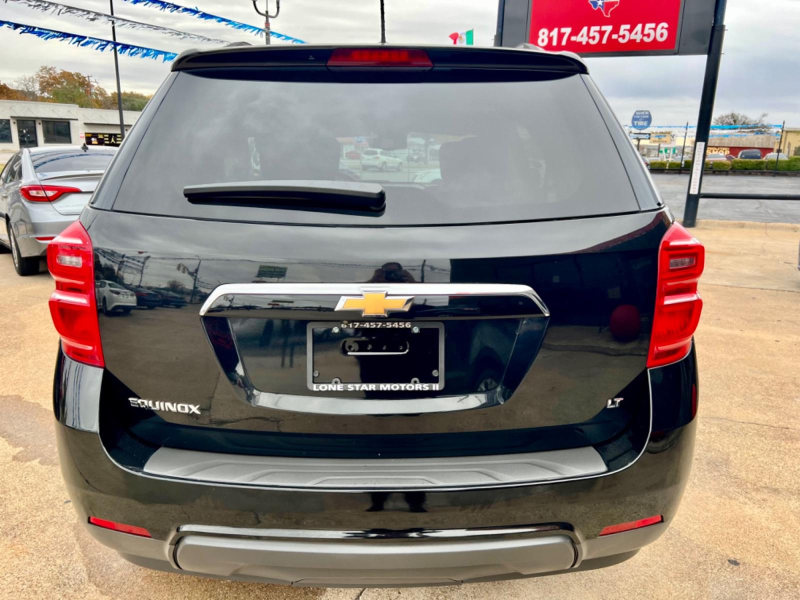 2017 BLACK /Gray CHEVROLET EQUINOX LT 4dr SUV w/1LT (2GNALCEK0H6) with an 2.4L I4 engine, Automatic 6-Speed transmission, located at 5900 E. Lancaster Ave., Fort Worth, TX, 76112, (817) 457-5456, 0.000000, 0.000000 - This is a 2017 Chevrolet Equinox LT 4dr SUV w/1LT that is in excellent condition. There are no dents or scratches. The interior is clean with no rips or tears or stains. All power windows, door locks and seats. Ice cold AC for those hot Texas summer days. It is equipped with a CD player, AM/FM radio - Photo #4