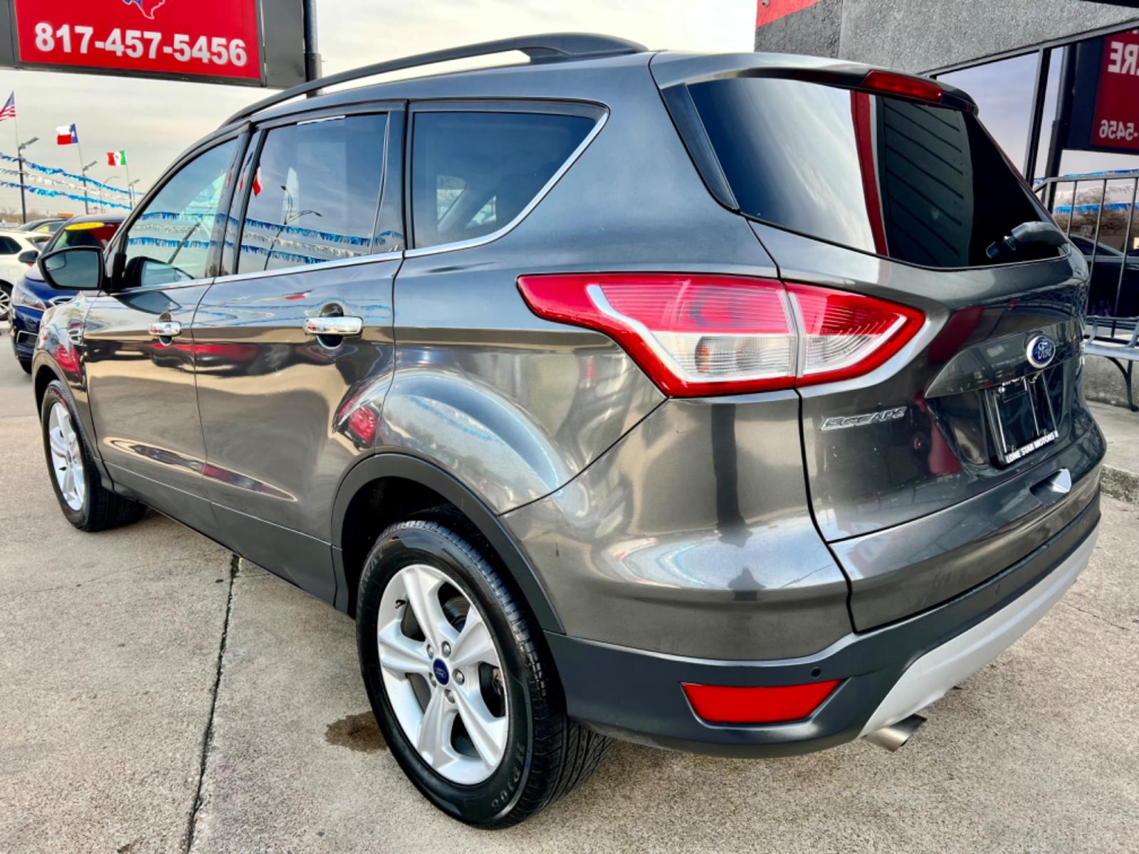2015 GRAY /Gray FORD ESCAPE SE 4dr SUV (1FMCU0GX9FU) with an 1.6L I4 engine, Automatic 6-Speed transmission, located at 5900 E. Lancaster Ave., Fort Worth, TX, 76112, (817) 457-5456, 0.000000, 0.000000 - This is a 2015 Ford Escape SE 4dr SUV that is in excellent condition. There are no dents or scratches. The interior is clean with no rips or tears or stains. All power windows, door locks and seats. Ice cold AC for those hot Texas summer days. It is equipped with a CD player, AM/FM radio, AUX port, - Photo #3