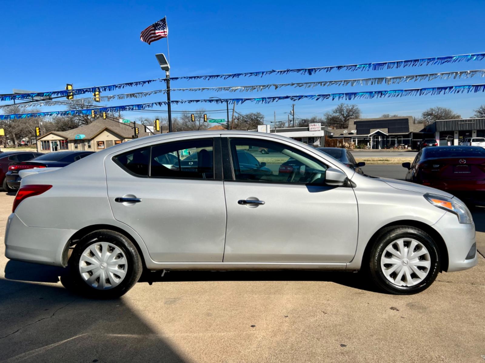 2019 SILVER /Gray NISSAN VERSA S 4dr Sedan (3N1CN7AP5KL) with an 1.6L I4 engine, Automatic 5-Speed transmission, located at 5900 E. Lancaster Ave., Fort Worth, TX, 76112, (817) 457-5456, 0.000000, 0.000000 - This is a 2019 NISSAN VERSA 4 DOOR SEDAN that is in excellent condition. There are no dents or scratches. The interior is clean with no rips or tears or stains. All power windows, door locks and seats. Ice cold AC for those hot Texas summer days. It is equipped with a CD player, AM/FM radio, AUX por - Photo #6