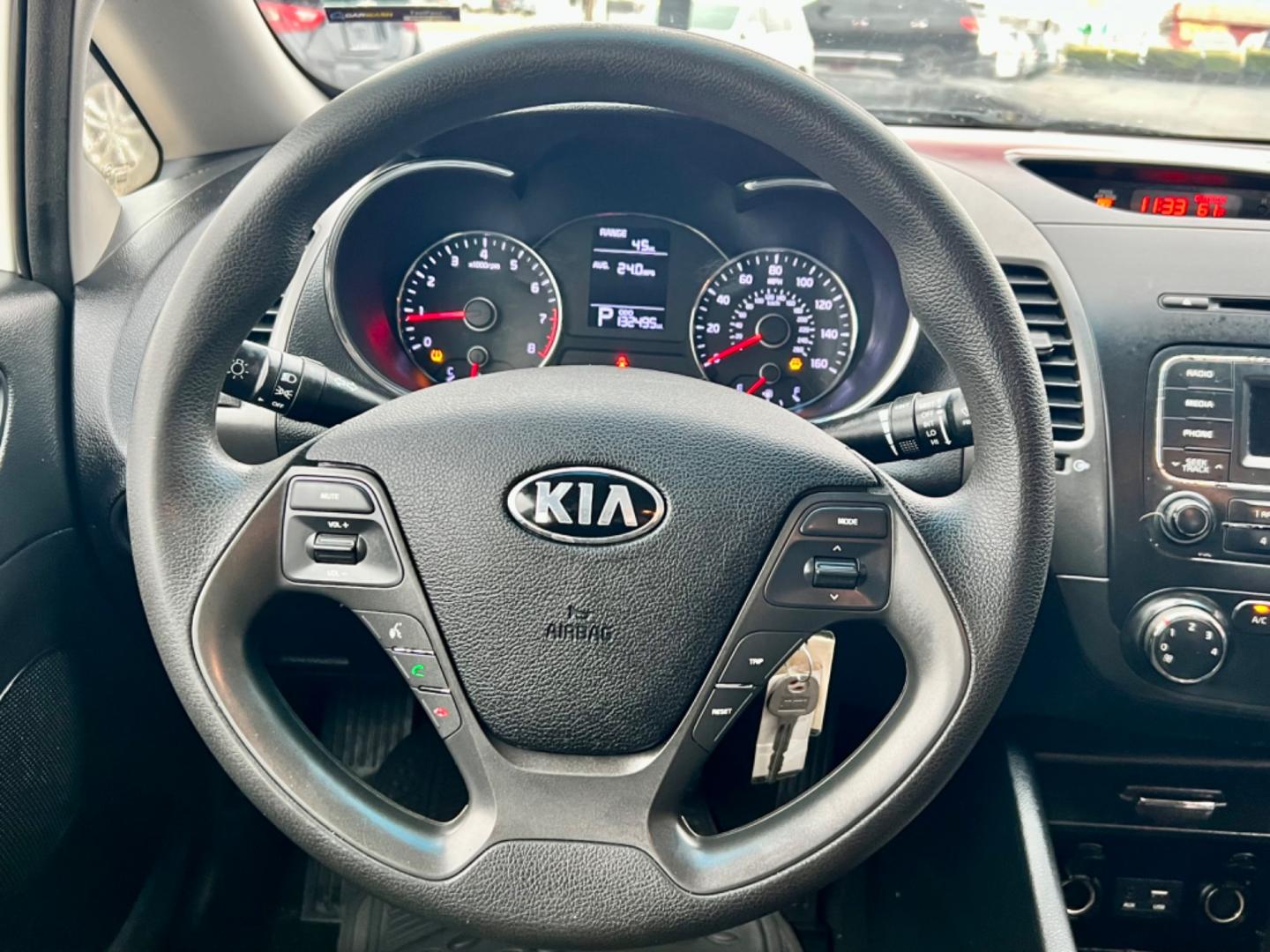 2016 WHITE /Gray KIA FORTE LX LX 4dr Sedan 6A (KNAFK4A65G5) with an 1.8L I4 engine, Automatic 6-Speed transmission, located at 5900 E. Lancaster Ave., Fort Worth, TX, 76112, (817) 457-5456, 0.000000, 0.000000 - This is a 2016 KIA FORTE LX 4 DOOR SEDAN that is in excellent condition. There are no dents or scratches. The interior is clean with no rips or tears or stains. All power windows, door locks and seats. Ice cold AC for those hot Texas summer days. It is equipped with a CD player, AM/FM radio, AUX por - Photo#19