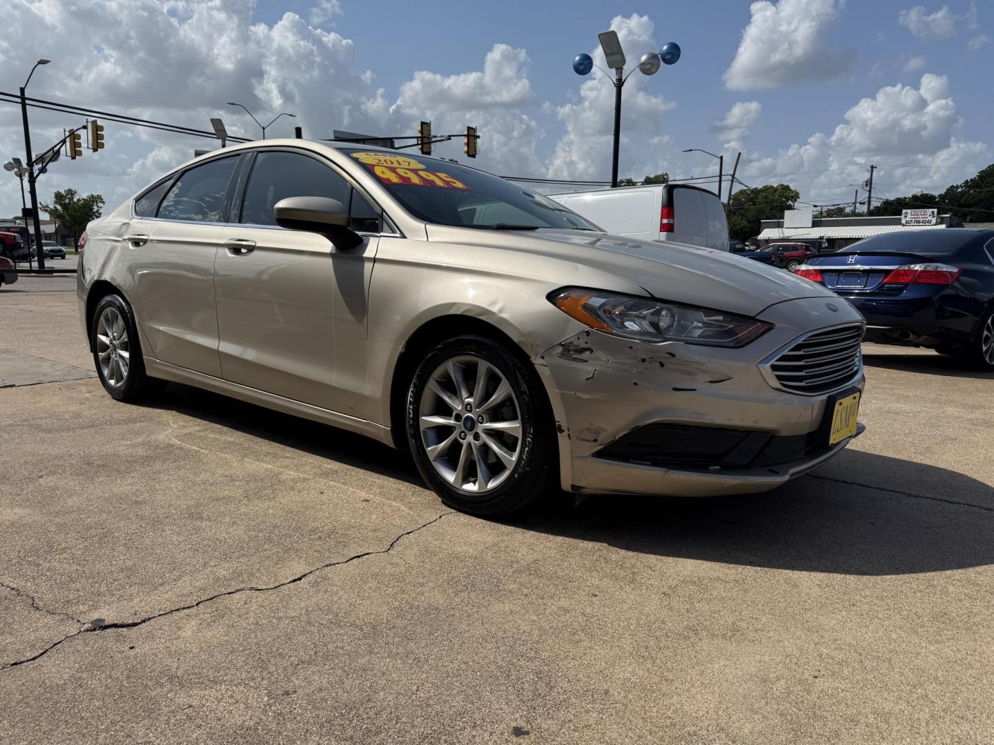 2017 GOLD FORD FUSION (3FA6P0H72HR) , located at 5900 E. Lancaster Ave., Fort Worth, TX, 76112, (817) 457-5456, 0.000000, 0.000000 - 2017 Ford Fusion – 4-Door Sedan | Cash Only Looking for a budget-friendly ride that gets you where you need to go? Check out this 2017 Ford Fusion available now for $4,995 cash only at Lone Star Motors II! ? Cold A/C ? Push to Start ? Backup Camera ? Smooth Drive ? Spacious Interior T - Photo#2