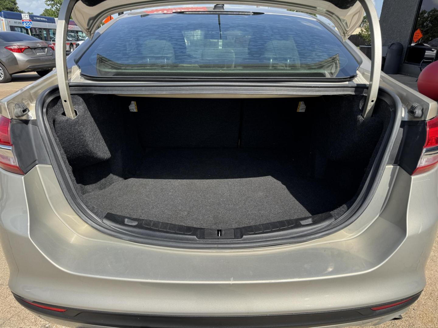 2017 GOLD FORD FUSION (3FA6P0H72HR) , located at 5900 E. Lancaster Ave., Fort Worth, TX, 76112, (817) 457-5456, 0.000000, 0.000000 - 2017 Ford Fusion – 4-Door Sedan | Cash Only Looking for a budget-friendly ride that gets you where you need to go? Check out this 2017 Ford Fusion available now for $4,995 cash only at Lone Star Motors II! ? Cold A/C ? Push to Start ? Backup Camera ? Smooth Drive ? Spacious Interior T - Photo#5