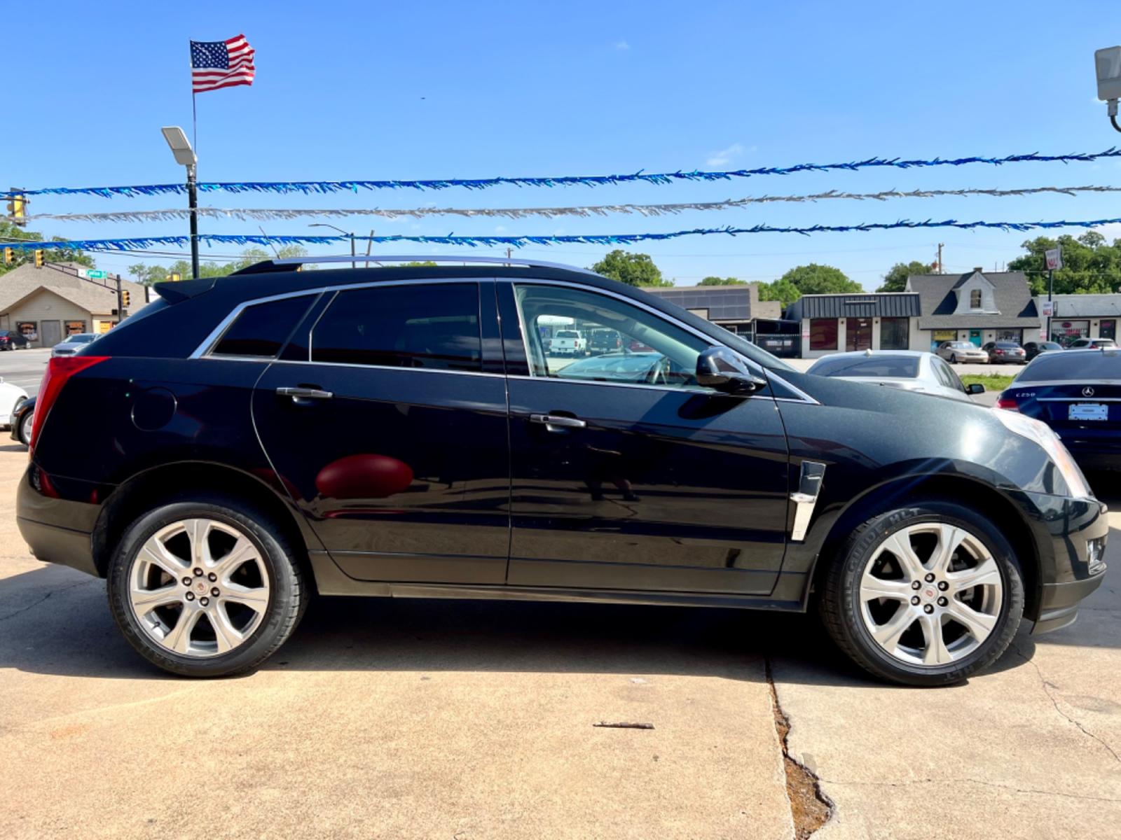 2011 BLACK CADILLAC SRX (3GYFNCEY0BS) , located at 5900 E. Lancaster Ave., Fort Worth, TX, 76112, (817) 457-5456, 0.000000, 0.000000 - This is a 2011 CADILLAC SRX 4 DOOR WAGON that is in excellent condition. There are no dents or scratches. The interior is clean with no rips or tears or stains. All power windows, door locks and seats. Ice cold AC for those hot Texas summer days. It is equipped with a CD player, AM/FM radio, AUX por - Photo #6