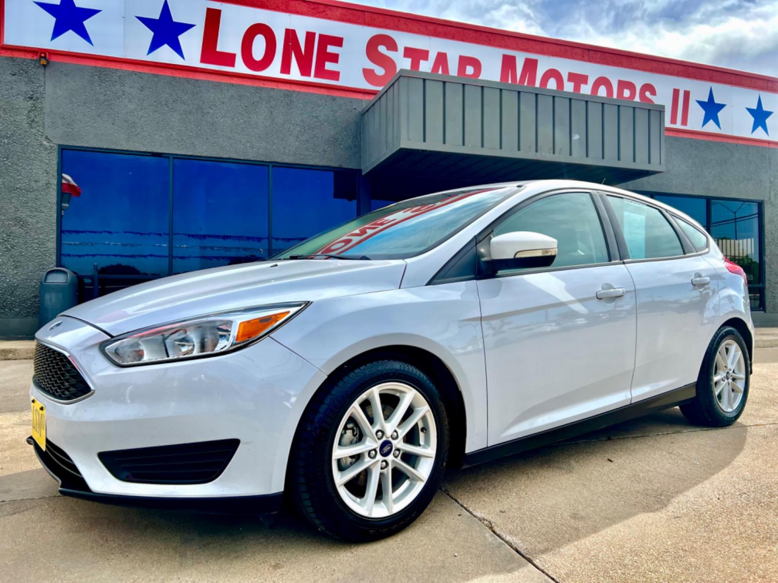 2016 WHITE FORD FOCUS (1FADP3K23GL) , located at 5900 E. Lancaster Ave., Fort Worth, TX, 76112, (817) 457-5456, 0.000000, 0.000000 - This is a 2016 FORD FOCUS 4 DOOR HATCHBACK that is in excellent condition. There are no dents or scratches. The interior is clean with no rips or tears or stains. All power windows, door locks and seats. Ice cold AC for those hot Texas summer days. It is equipped with a CD player, AM/FM radio, AUX p - Photo #1