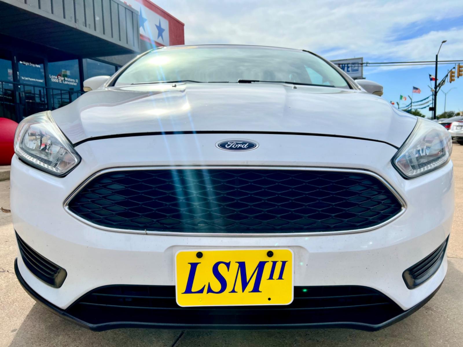2016 WHITE FORD FOCUS (1FADP3K23GL) , located at 5900 E. Lancaster Ave., Fort Worth, TX, 76112, (817) 457-5456, 0.000000, 0.000000 - This is a 2016 FORD FOCUS 4 DOOR HATCHBACK that is in excellent condition. There are no dents or scratches. The interior is clean with no rips or tears or stains. All power windows, door locks and seats. Ice cold AC for those hot Texas summer days. It is equipped with a CD player, AM/FM radio, AUX p - Photo #2
