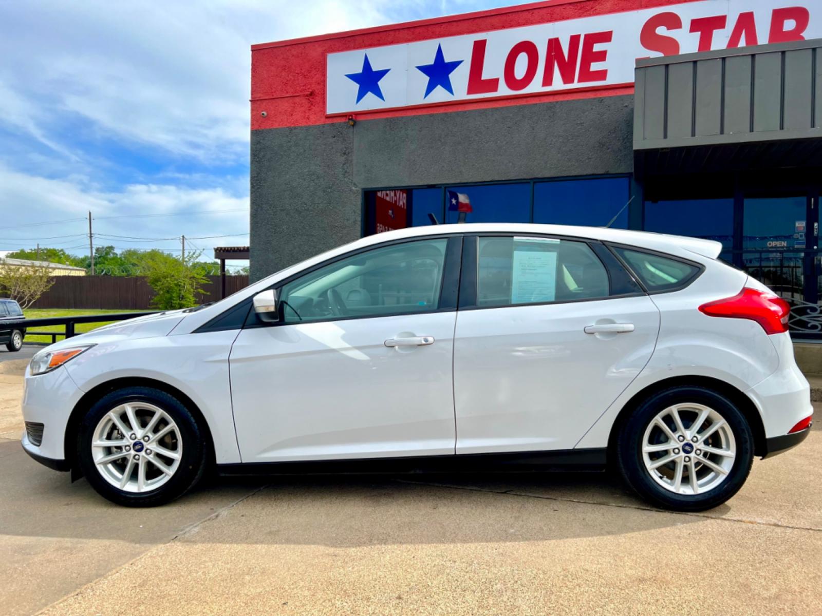 2016 WHITE FORD FOCUS (1FADP3K23GL) , located at 5900 E. Lancaster Ave., Fort Worth, TX, 76112, (817) 457-5456, 0.000000, 0.000000 - This is a 2016 FORD FOCUS 4 DOOR HATCHBACK that is in excellent condition. There are no dents or scratches. The interior is clean with no rips or tears or stains. All power windows, door locks and seats. Ice cold AC for those hot Texas summer days. It is equipped with a CD player, AM/FM radio, AUX p - Photo #3
