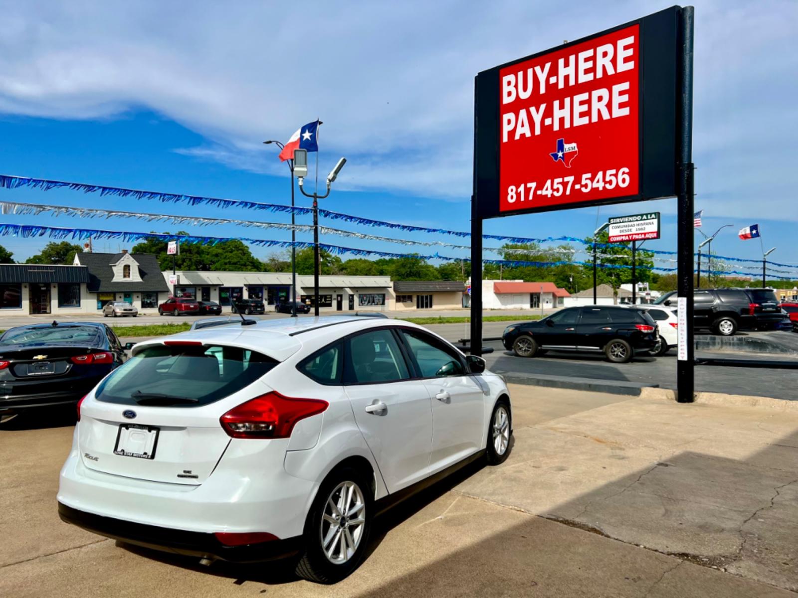 2016 WHITE FORD FOCUS (1FADP3K23GL) , located at 5900 E. Lancaster Ave., Fort Worth, TX, 76112, (817) 457-5456, 0.000000, 0.000000 - This is a 2016 FORD FOCUS 4 DOOR HATCHBACK that is in excellent condition. There are no dents or scratches. The interior is clean with no rips or tears or stains. All power windows, door locks and seats. Ice cold AC for those hot Texas summer days. It is equipped with a CD player, AM/FM radio, AUX p - Photo #6