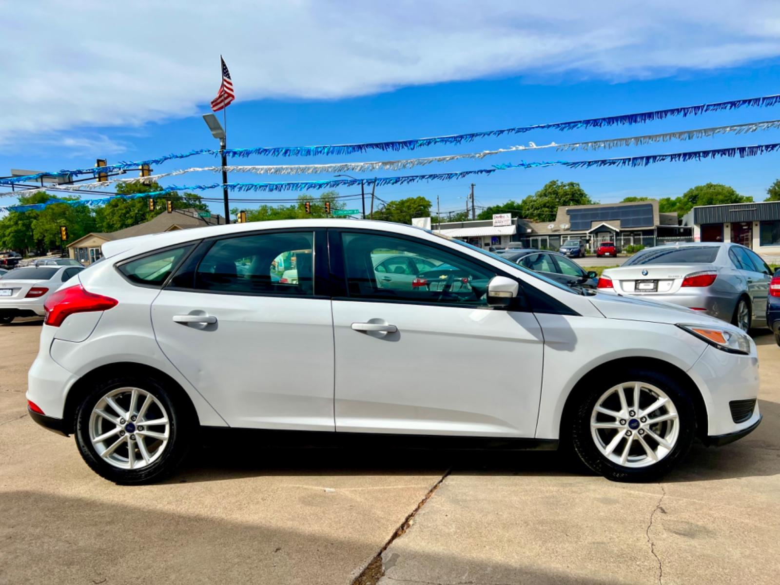 2016 WHITE FORD FOCUS (1FADP3K23GL) , located at 5900 E. Lancaster Ave., Fort Worth, TX, 76112, (817) 457-5456, 0.000000, 0.000000 - This is a 2016 FORD FOCUS 4 DOOR HATCHBACK that is in excellent condition. There are no dents or scratches. The interior is clean with no rips or tears or stains. All power windows, door locks and seats. Ice cold AC for those hot Texas summer days. It is equipped with a CD player, AM/FM radio, AUX p - Photo #7