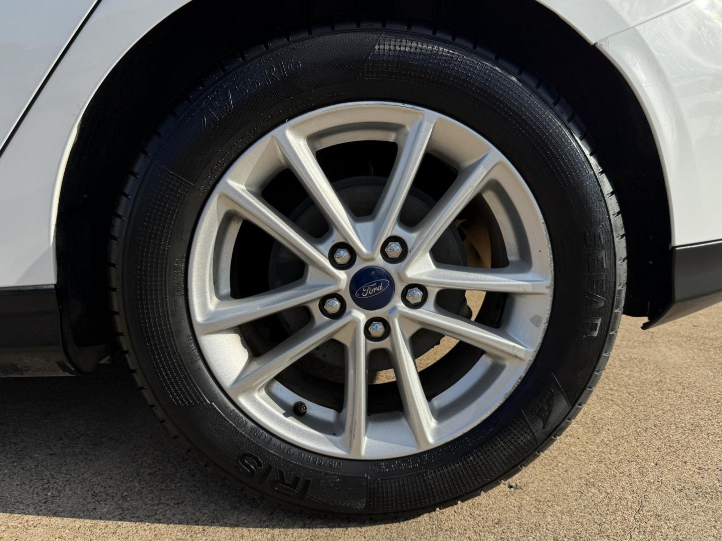 2016 WHITE FORD FOCUS (1FADP3K23GL) , located at 5900 E. Lancaster Ave., Fort Worth, TX, 76112, (817) 457-5456, 0.000000, 0.000000 - This is a 2016 FORD FOCUS 4 DOOR HATCHBACK that is in excellent condition. There are no dents or scratches. The interior is clean with no rips or tears or stains. All power windows, door locks and seats. Ice cold AC for those hot Texas summer days. It is equipped with a CD player, AM/FM radio, AUX p - Photo#21