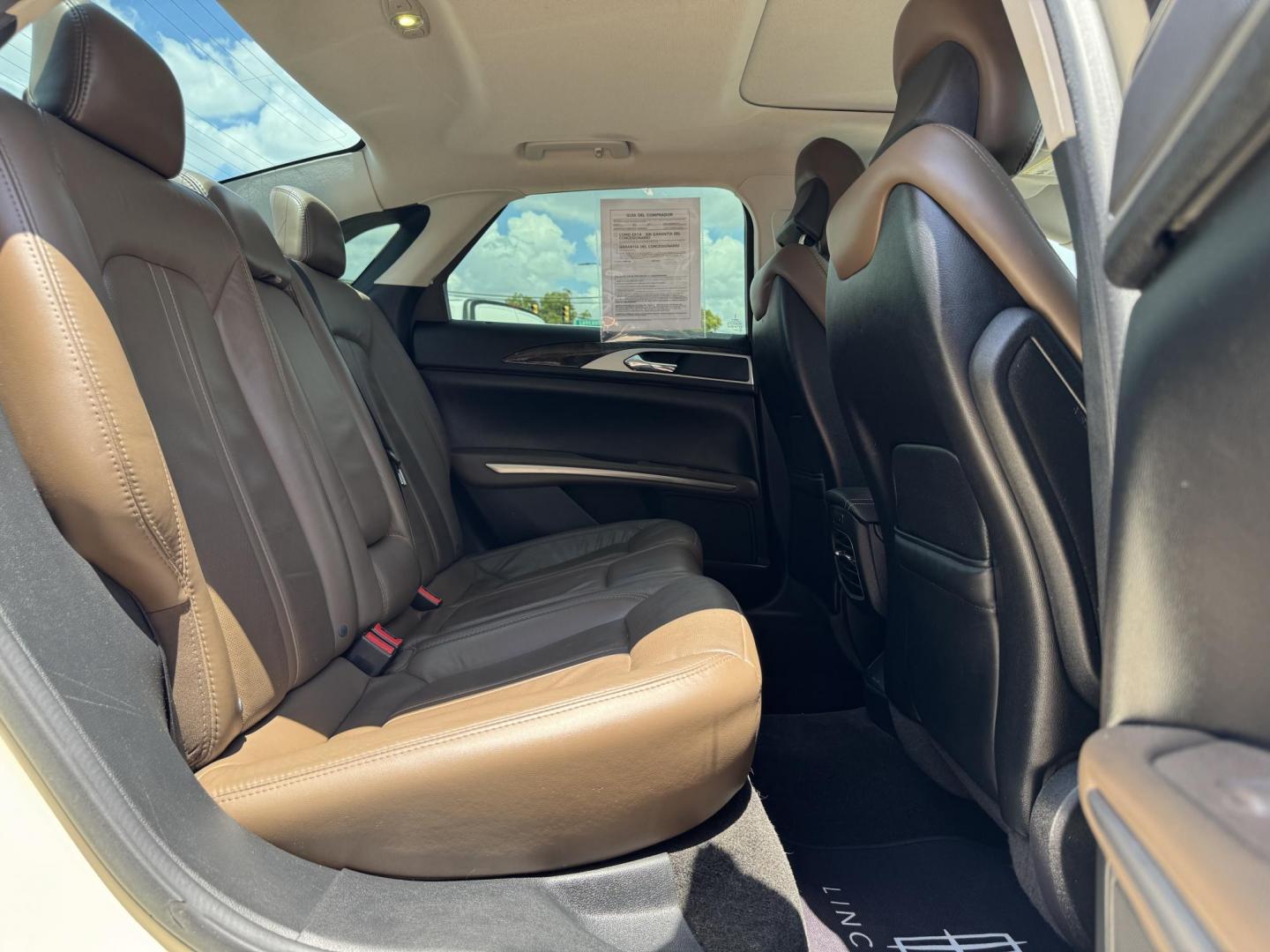 2016 TAN LINCOLN MKZ (3LN6L2GK8GR) , located at 5900 E. Lancaster Ave., Fort Worth, TX, 76112, (817) 457-5456, 0.000000, 0.000000 - This is a 2016 LINCOLN MKZ 4 DOOR SEDAN that is in excellent condition. There are no dents or scratches. The interior is clean with no rips or tears or stains. All power windows, door locks and seats. Ice cold AC for those hot Texas summer days. It is equipped with a CD player, AM/FM radio, AUX port - Photo#13