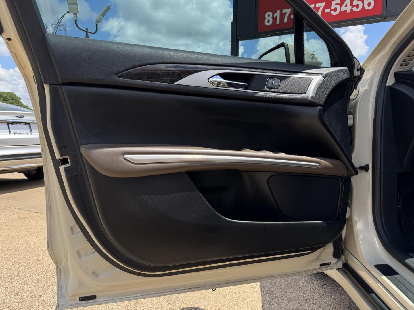 2016 TAN LINCOLN MKZ (3LN6L2GK8GR) , located at 5900 E. Lancaster Ave., Fort Worth, TX, 76112, (817) 457-5456, 0.000000, 0.000000 - This is a 2016 LINCOLN MKZ 4 DOOR SEDAN that is in excellent condition. There are no dents or scratches. The interior is clean with no rips or tears or stains. All power windows, door locks and seats. Ice cold AC for those hot Texas summer days. It is equipped with a CD player, AM/FM radio, AUX port - Photo#7