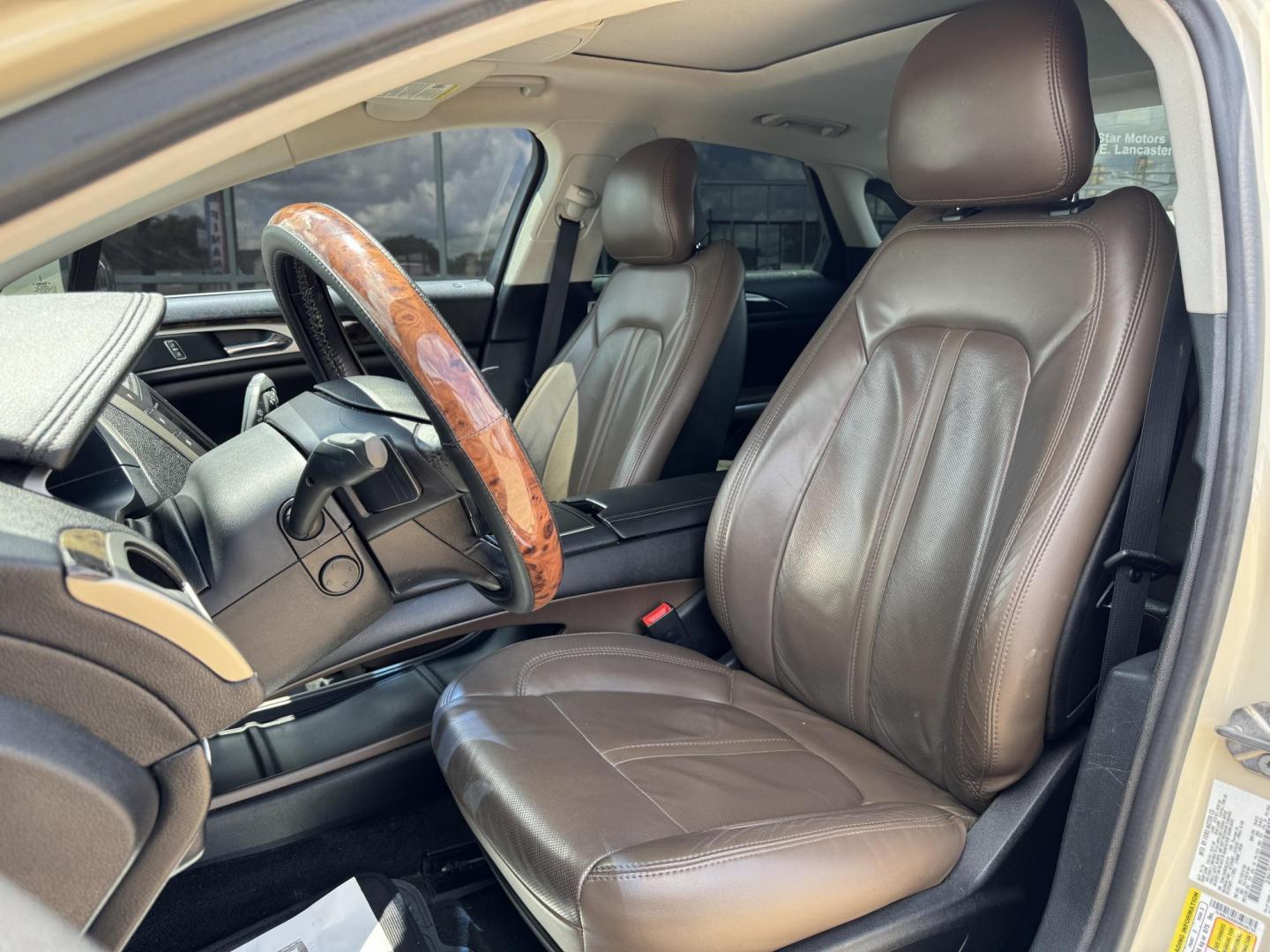 2016 TAN LINCOLN MKZ (3LN6L2GK8GR) , located at 5900 E. Lancaster Ave., Fort Worth, TX, 76112, (817) 457-5456, 0.000000, 0.000000 - This is a 2016 LINCOLN MKZ 4 DOOR SEDAN that is in excellent condition. There are no dents or scratches. The interior is clean with no rips or tears or stains. All power windows, door locks and seats. Ice cold AC for those hot Texas summer days. It is equipped with a CD player, AM/FM radio, AUX port - Photo#9