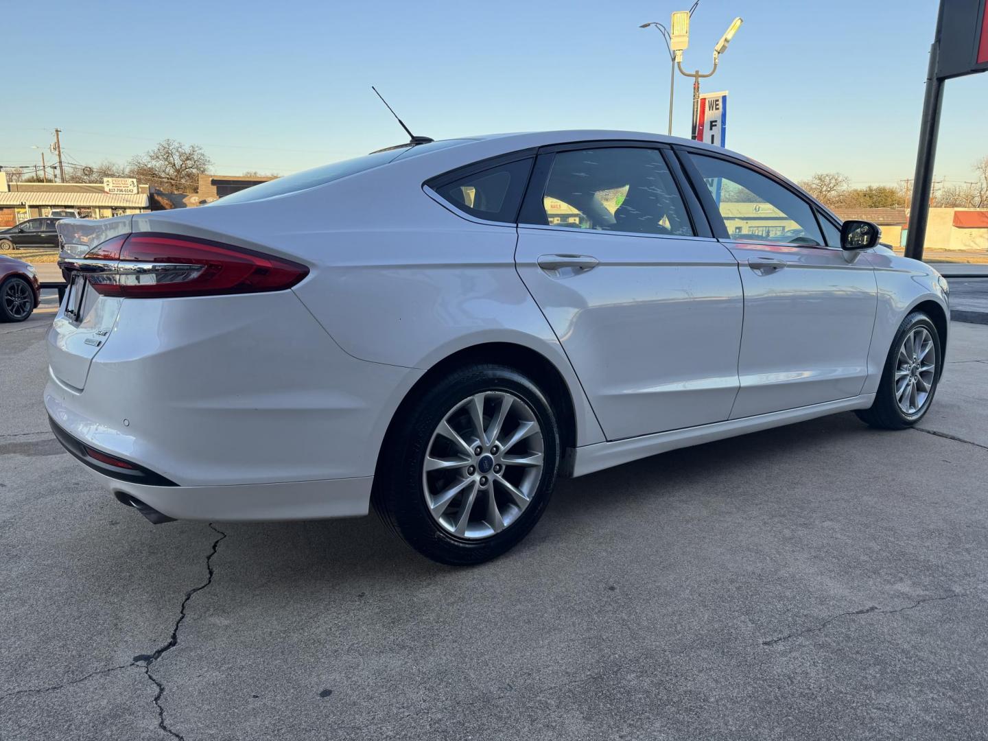 2017 WHITE /Black FORD FUSION (3FA6P0HD5HR) , located at 5900 E. Lancaster Ave., Fort Worth, TX, 76112, (817) 457-5456, 0.000000, 0.000000 - This is a 2017 FORD FUSION 4 DOOR SEDAN that is in excellent condition. There are no dents or scratches. The interior is clean with no rips or tears or stains. All power windows, door locks and seats. Ice cold AC for those hot Texas summer days. It is equipped with a CD player, AM/FM radio, AUX port - Photo#4