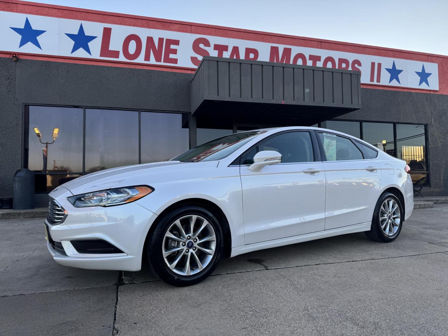 2017 WHITE /Black FORD FUSION (3FA6P0HD5HR) , located at 5900 E. Lancaster Ave., Fort Worth, TX, 76112, (817) 457-5456, 0.000000, 0.000000 - This is a 2017 FORD FUSION 4 DOOR SEDAN that is in excellent condition. There are no dents or scratches. The interior is clean with no rips or tears or stains. All power windows, door locks and seats. Ice cold AC for those hot Texas summer days. It is equipped with a CD player, AM/FM radio, AUX port - Photo#1