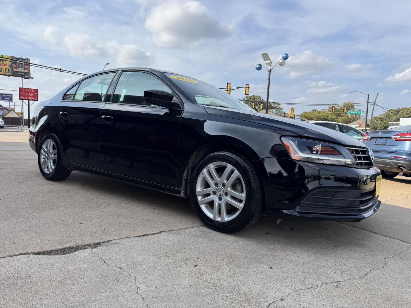 2018 BLACK /GRAY VOLKSWAGEN JETTA 1.4T S (3VW2B7AJ4JM) , located at 5900 E. Lancaster Ave., Fort Worth, TX, 76112, (817) 457-5456, 0.000000, 0.000000 - This is a 2018 VOLKSWAGEN JETTA 4 DR SEDAN. All power windows, door locks and seats. Ice cold AC for those hot Texas summer days. It is equipped with a CD player, AM/FM radio, AUX port, Bluetooth connectivity and Sirius XM radio capability. It runs and drives like new. The tires are like new with pl - Photo#2