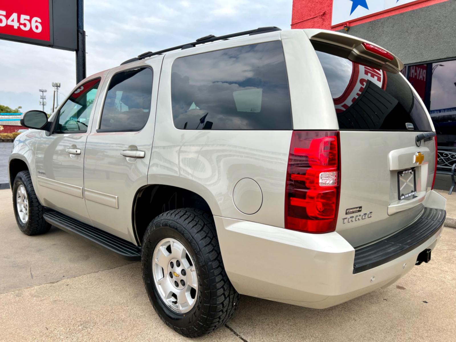 2014 GOLD CHEVROLET TAHOE LS (1GNSCAE04ER) , located at 5900 E. Lancaster Ave., Fort Worth, TX, 76112, (817) 457-5456, 0.000000, 0.000000 - This is a 2014 CHEVROLET TAHOE LS 4 DOOR SUV that is in excellent condition. There are no dents or scratches. The interior is clean with no rips or tears or stains. All power windows, door locks and seats. Ice cold AC for those hot Texas summer days. It is equipped with a CD player, AM/FM radio, AUX - Photo #4