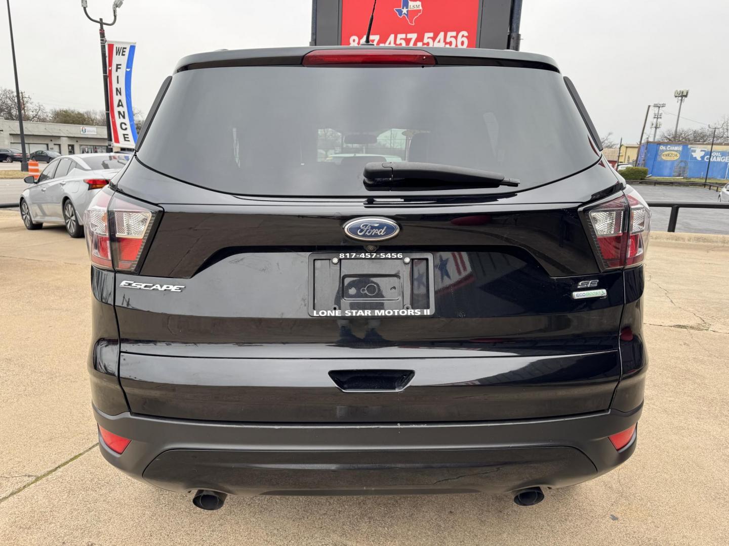 2018 BLACK FORD ESCAPE SE (1FMCU0GD4JU) , located at 5900 E. Lancaster Ave., Fort Worth, TX, 76112, (817) 457-5456, 0.000000, 0.000000 - Photo#5