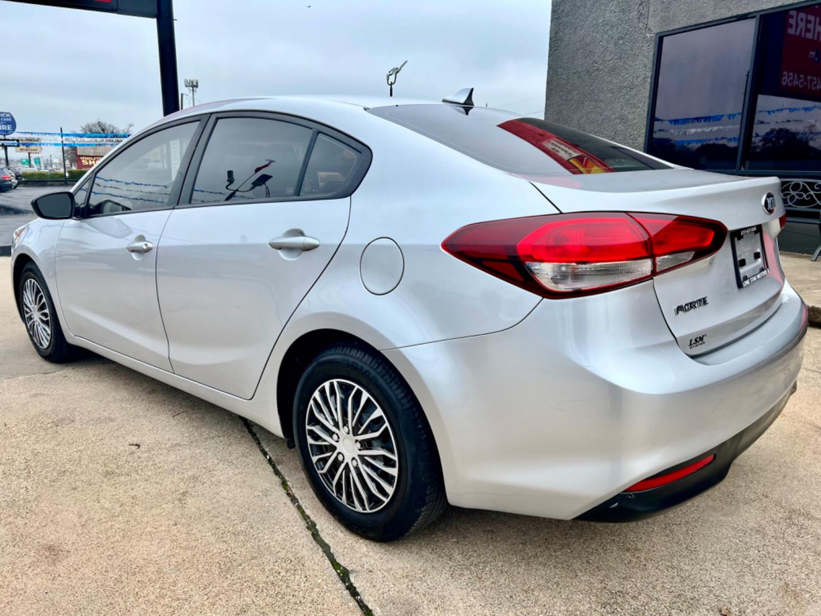 2018 GRAY KIA FORTE LX (3KPFK4A74JE) , located at 5900 E. Lancaster Ave., Fort Worth, TX, 76112, (817) 457-5456, 0.000000, 0.000000 - This is a 2018 KIA FORTE LX 4 DR SEDAN that is in excellent condition. The interior is clean with no rips or tears or stains. All power windows, door locks and seats. Ice cold AC for those hot Texas summer days. It is equipped with a CD player, AM/FM radio, AUX port, Bluetooth connectivity and Siriu - Photo #3