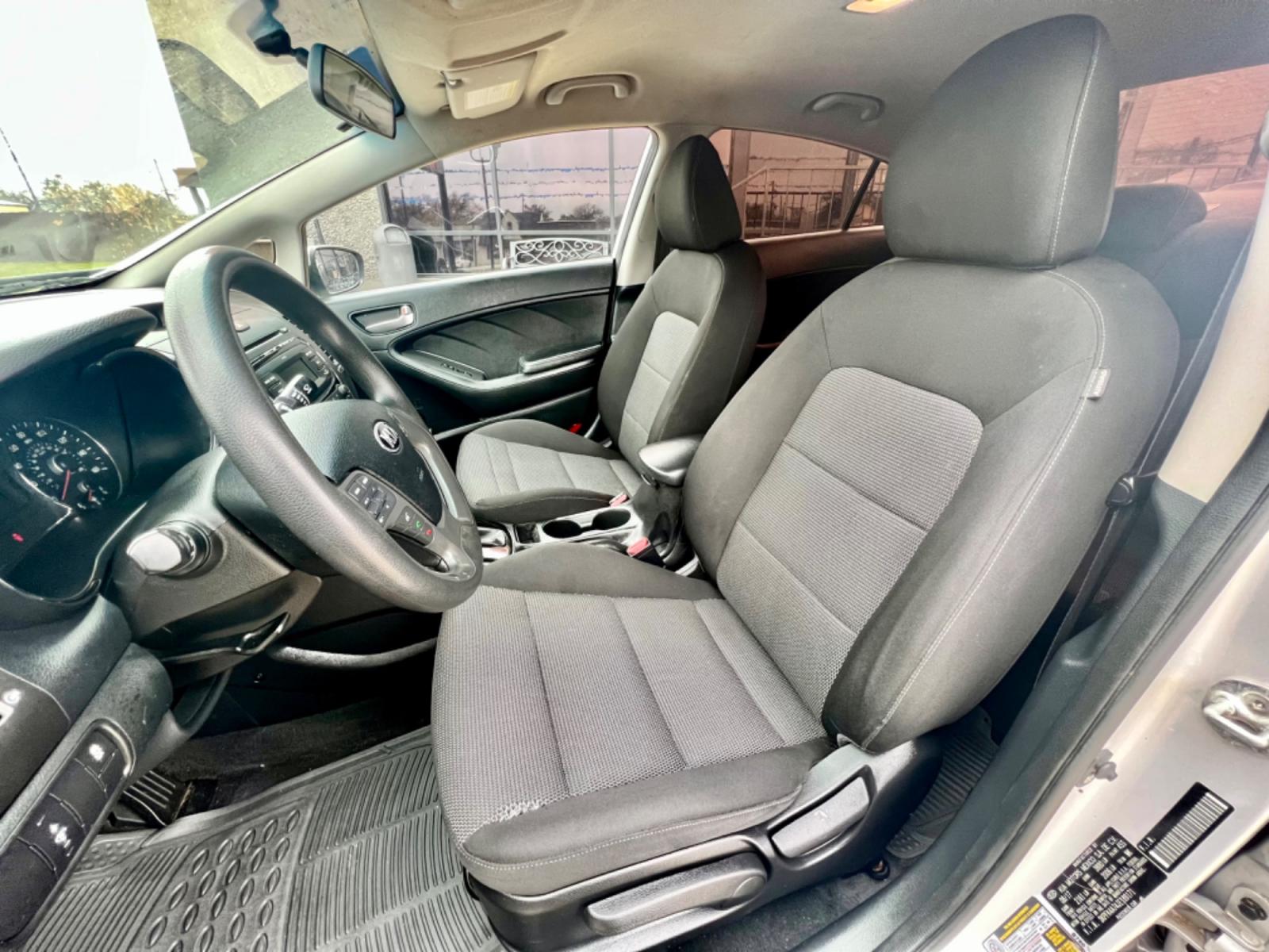 2018 GRAY KIA FORTE LX (3KPFK4A74JE) , located at 5900 E. Lancaster Ave., Fort Worth, TX, 76112, (817) 457-5456, 0.000000, 0.000000 - This is a 2018 KIA FORTE LX 4 DR SEDAN that is in excellent condition. The interior is clean with no rips or tears or stains. All power windows, door locks and seats. Ice cold AC for those hot Texas summer days. It is equipped with a CD player, AM/FM radio, AUX port, Bluetooth connectivity and Siriu - Photo #9