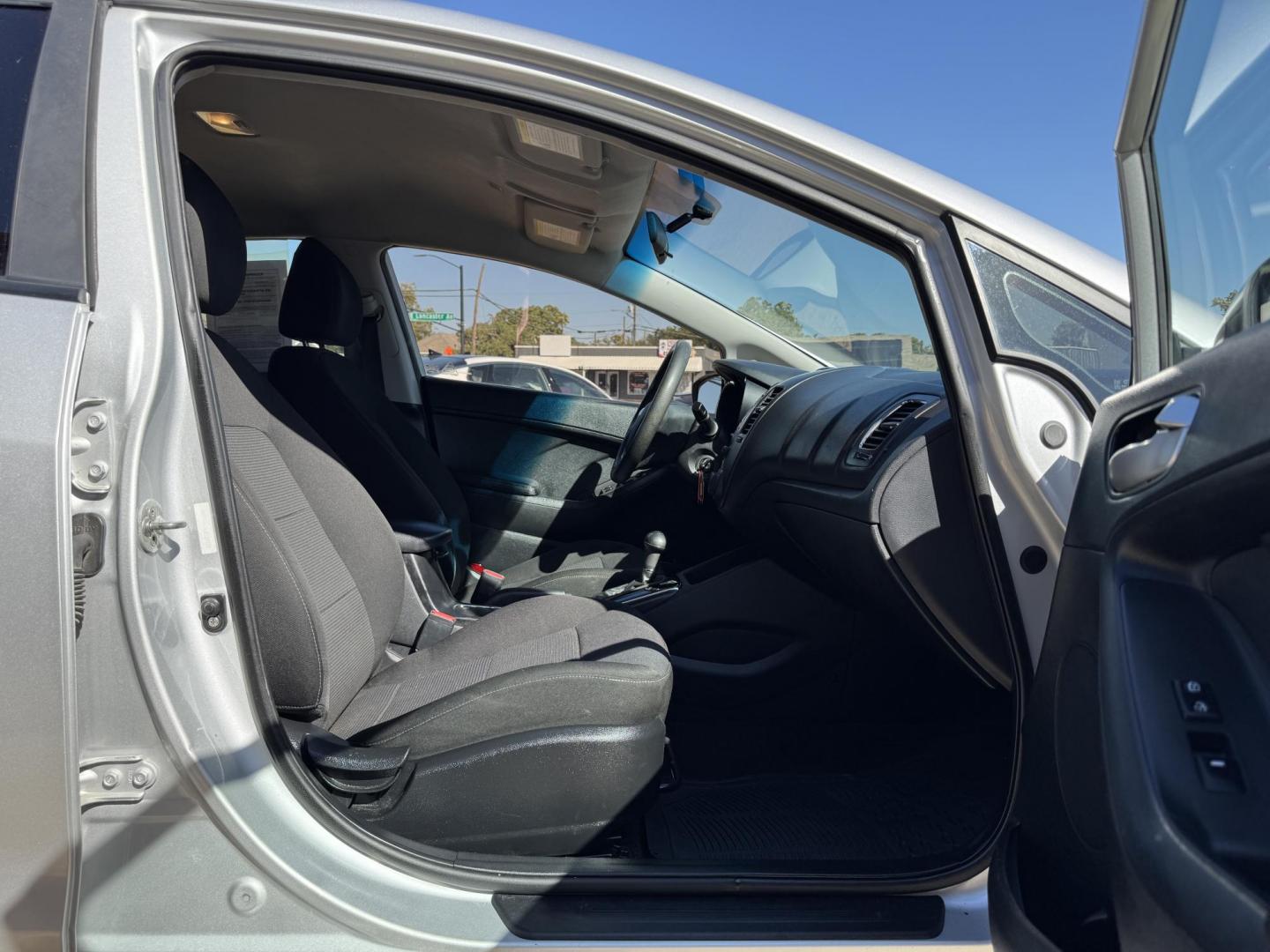 2018 GRAY KIA FORTE LX (3KPFK4A74JE) , located at 5900 E. Lancaster Ave., Fort Worth, TX, 76112, (817) 457-5456, 0.000000, 0.000000 - This is a 2018 KIA FORTE LX 4 DR SEDAN that is in excellent condition. The interior is clean with no rips or tears or stains. All power windows, door locks and seats. Ice cold AC for those hot Texas summer days. It is equipped with a CD player, AM/FM radio, AUX port, Bluetooth connectivity and Siriu - Photo#14