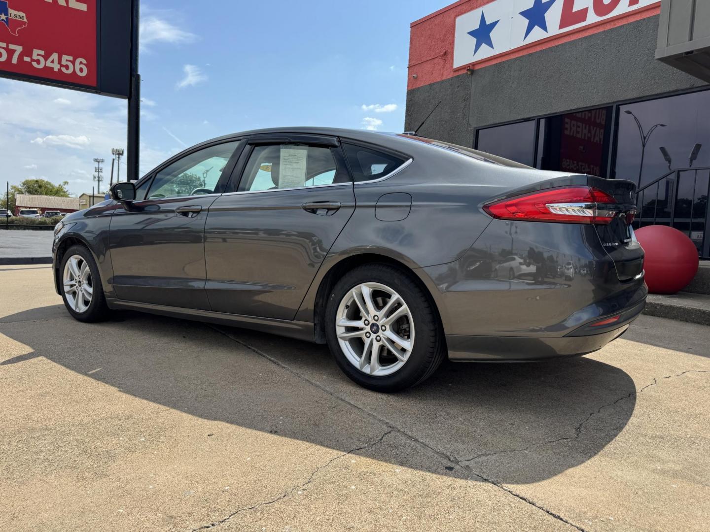2018 SILVER /TAN FORD FUSION SE SE (3FA6P0HD6JR) with an 1.5L engine, 6-Speed Automatic transmission, located at 5900 E. Lancaster Ave., Fort Worth, TX, 76112, (817) 457-5456, 0.000000, 0.000000 - 2018 Ford Fusion SE for Sale in Fort Worth, TX – This stylish sedan combines fuel efficiency with comfort, offering up to 32 MPG highway, a smooth 6-speed automatic transmission, and seating for five. Equipped with Bluetooth, a rearview camera, and alloy wheels, the Fusion SE delivers both conveni - Photo#6