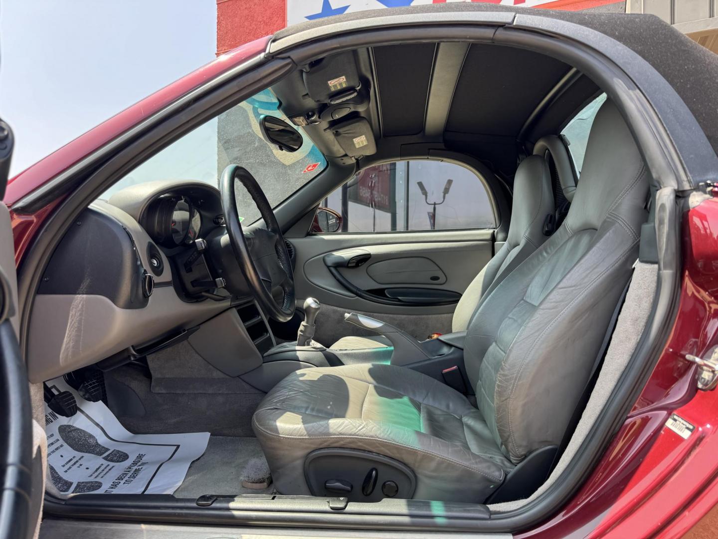 1998 Burgundy /Gray Porsche Boxster Base (WP0CA2989WU) with an 2.5L H6 DOHC 24V engine, 5-Speed Manual Overdrive transmission, located at 5900 E. Lancaster Ave., Fort Worth, TX, 76112, (817) 457-5456, 0.000000, 0.000000 - Immaculate 1998 Porsche Boxster | 5-Speed Manual | 36K Original Miles Includes factory hardtop, carriage, cover & custom satchel. Collector-grade condition – rare find, ready to turn heads. 2 Owner Vehicle Carfax available Garage Kept - Photo#12