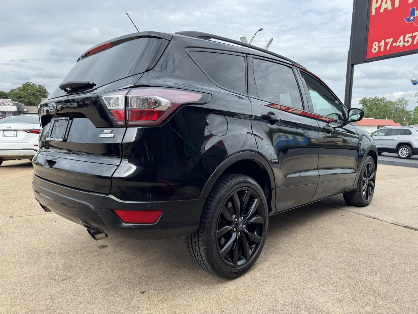 2017 BLACK FORD ESCAPE SE (1FMCU0GD1HU) , located at 5900 E. Lancaster Ave., Fort Worth, TX, 76112, (817) 457-5456, 0.000000, 0.000000 - Photo#3