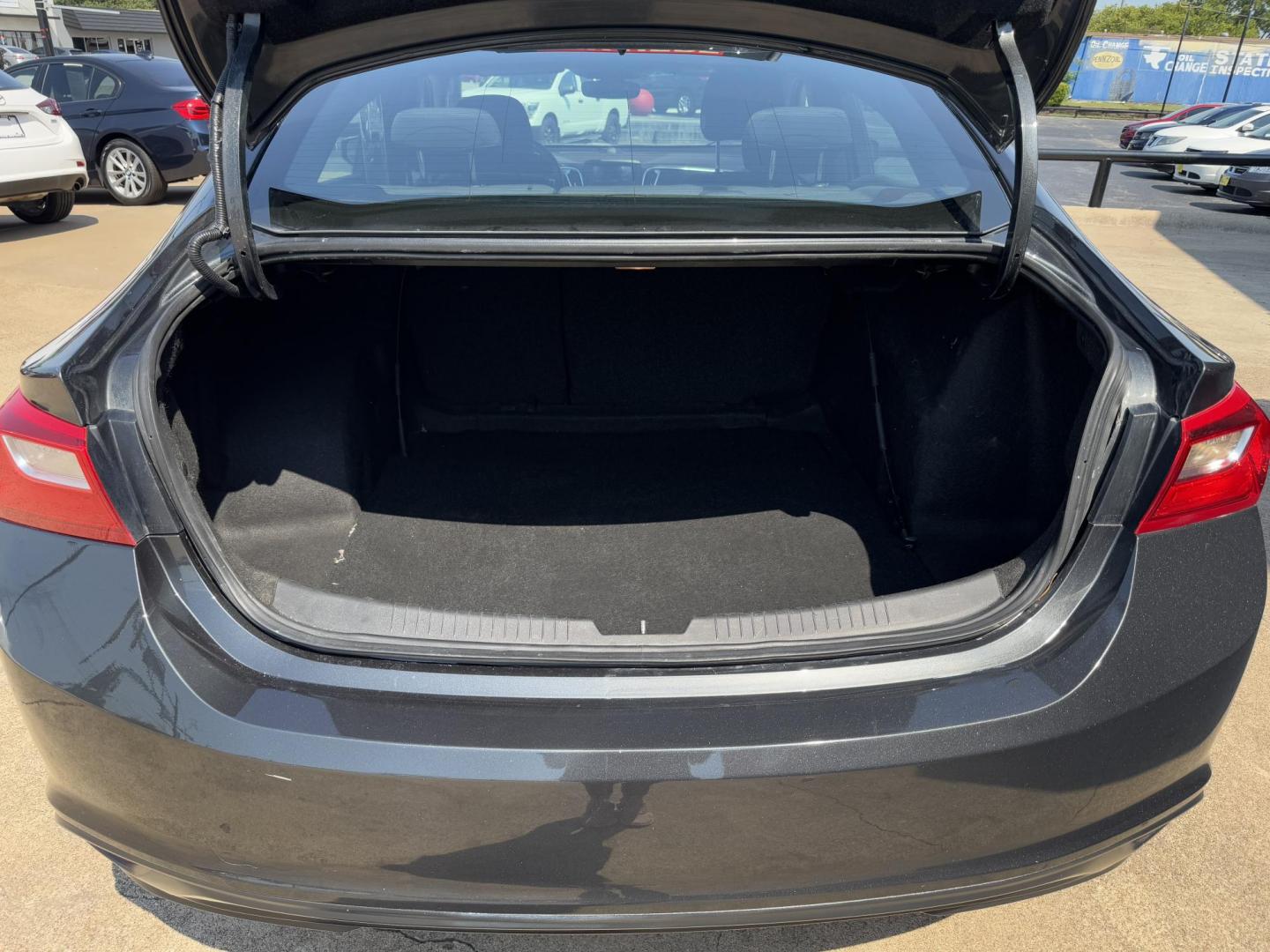 2016 GRAY /BLACK CHEVROLET MALIBU LT (1LT) 1LT (1G1ZE5ST1GF) with an 1.5L engine, 6-Speed Automatic transmission, located at 5900 E. Lancaster Ave., Fort Worth, TX, 76112, (817) 457-5456, 0.000000, 0.000000 - The 2016 Chevrolet Malibu 1LT is powered by a 1.5L 4-cylinder engine paired with a 6-speed automatic transmission and front-wheel drive, offering 27 MPG city and 37 MPG highway for excellent fuel efficiency. The sedan comfortably seats 5 passengers and features a well-designed interior for daily dri - Photo#5