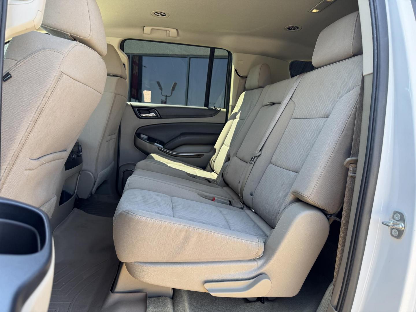 2016 WHITE /TAN CHEVROLET SUBURBAN LS LS 2WD (1GNSCGKC2GR) with an 5.3L V8 OHV 16V engine, 6-Speed Automatic transmission, located at 5900 E. Lancaster Ave., Fort Worth, TX, 76112, (817) 457-5456, 0.000000, 0.000000 - 2016 Chevrolet Suburban LS 2WD This full-size SUV has everything you need for family or work. Equipped with a 5.3L V8 engine, 6-speed automatic, and towing up to 8,300 lbs., it balances power with efficiency at 16/23 MPG. Inside, enjoy seating for 8 with a 3rd row, premium cloth power seats, and du - Photo#12