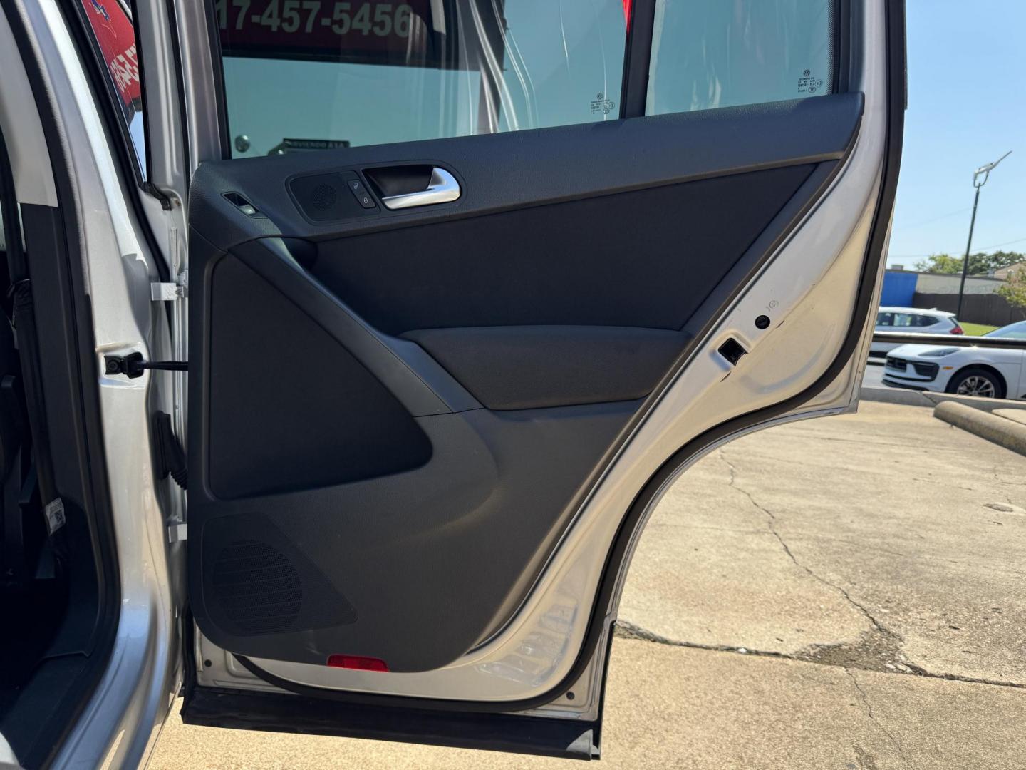 2014 SILVER /BLACK VOLKSWAGEN TIGUAN S; SE; SEL; W S (WVGAV3AX2EW) with an 2.0L Turbocharged 4-Cylinder engine, 6-Speed Automatic transmission, located at 5900 E. Lancaster Ave., Fort Worth, TX, 76112, (817) 457-5456, 0.000000, 0.000000 - Sporty and versatile, this Tiguan features a 2.0L turbocharged engine, seating for 5 passengers, and up to 23.8 cu. ft. of cargo space. Enjoy features like black cloth interior, power locks, ABS, and stability control—a compact SUV with German engineering, efficiency, and comfort all in one. - Photo#12