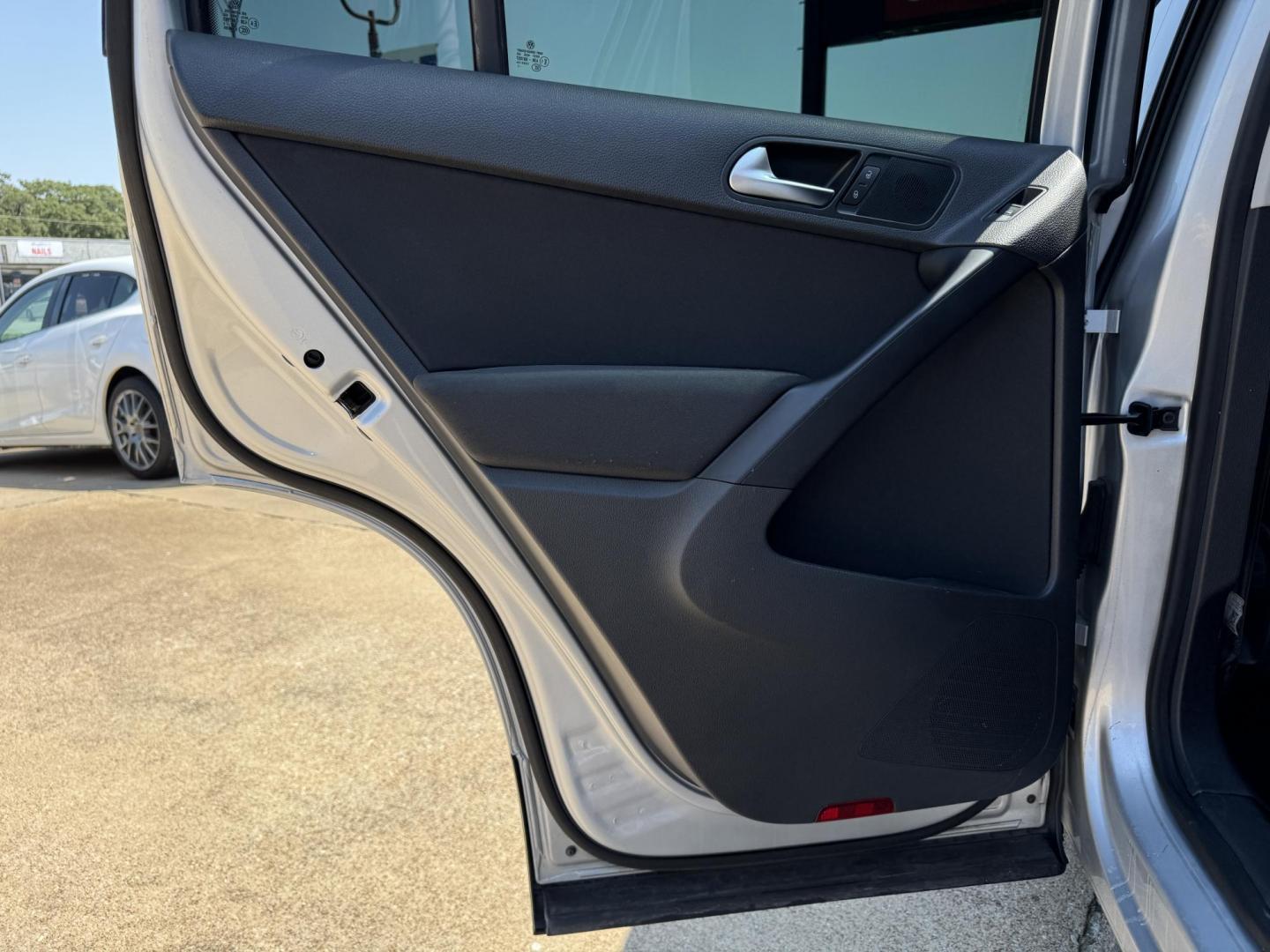 2014 SILVER /BLACK VOLKSWAGEN TIGUAN S; SE; SEL; W S (WVGAV3AX2EW) with an 2.0L Turbocharged 4-Cylinder engine, 6-Speed Automatic transmission, located at 5900 E. Lancaster Ave., Fort Worth, TX, 76112, (817) 457-5456, 0.000000, 0.000000 - Sporty and versatile, this Tiguan features a 2.0L turbocharged engine, seating for 5 passengers, and up to 23.8 cu. ft. of cargo space. Enjoy features like black cloth interior, power locks, ABS, and stability control—a compact SUV with German engineering, efficiency, and comfort all in one. - Photo#10