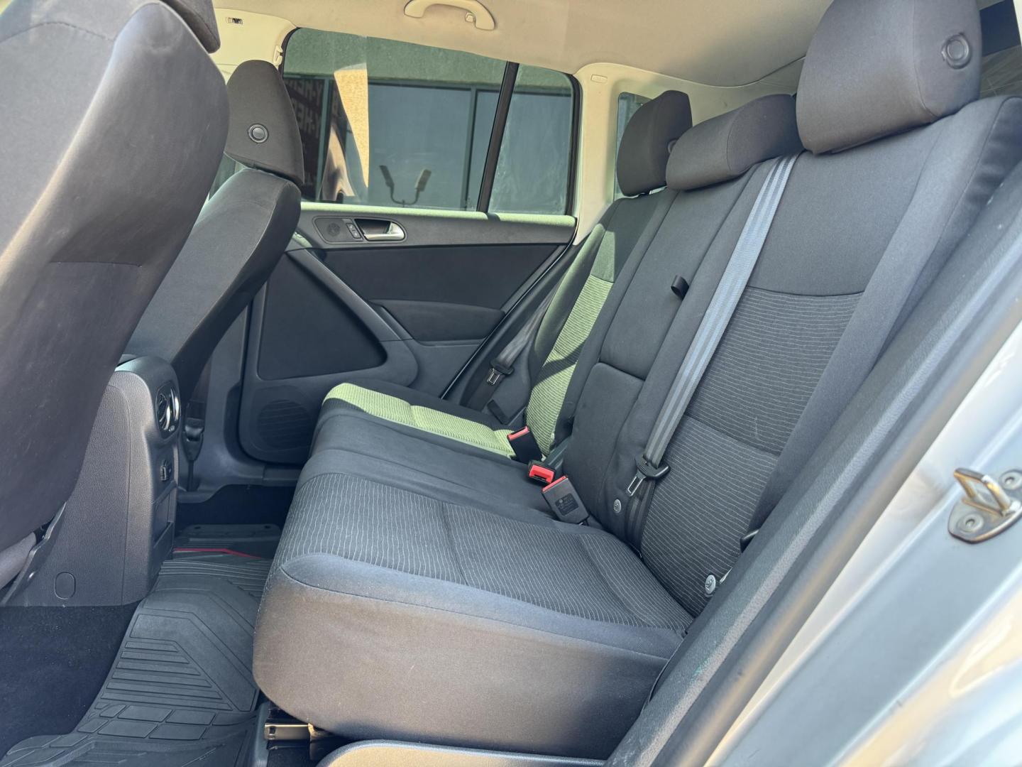 2014 SILVER /BLACK VOLKSWAGEN TIGUAN S; SE; SEL; W S (WVGAV3AX2EW) with an 2.0L Turbocharged 4-Cylinder engine, 6-Speed Automatic transmission, located at 5900 E. Lancaster Ave., Fort Worth, TX, 76112, (817) 457-5456, 0.000000, 0.000000 - Sporty and versatile, this Tiguan features a 2.0L turbocharged engine, seating for 5 passengers, and up to 23.8 cu. ft. of cargo space. Enjoy features like black cloth interior, power locks, ABS, and stability control—a compact SUV with German engineering, efficiency, and comfort all in one. - Photo#11