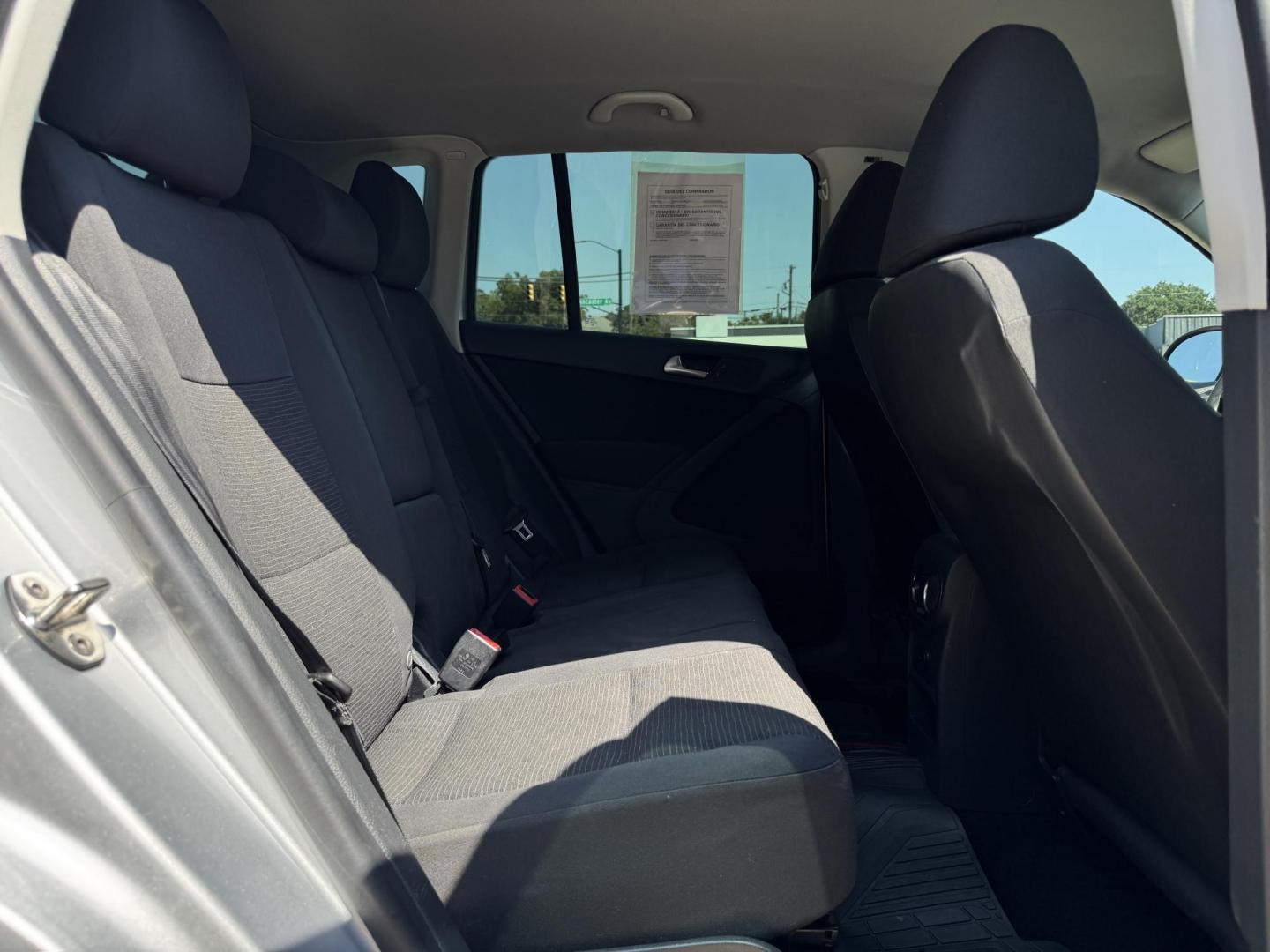 2014 SILVER /BLACK VOLKSWAGEN TIGUAN S; SE; SEL; W S (WVGAV3AX2EW) with an 2.0L Turbocharged 4-Cylinder engine, 6-Speed Automatic transmission, located at 5900 E. Lancaster Ave., Fort Worth, TX, 76112, (817) 457-5456, 0.000000, 0.000000 - Sporty and versatile, this Tiguan features a 2.0L turbocharged engine, seating for 5 passengers, and up to 23.8 cu. ft. of cargo space. Enjoy features like black cloth interior, power locks, ABS, and stability control—a compact SUV with German engineering, efficiency, and comfort all in one. - Photo#13