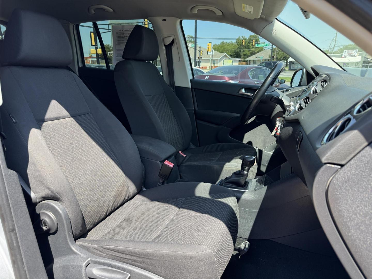 2014 SILVER /BLACK VOLKSWAGEN TIGUAN S; SE; SEL; W S (WVGAV3AX2EW) with an 2.0L Turbocharged 4-Cylinder engine, 6-Speed Automatic transmission, located at 5900 E. Lancaster Ave., Fort Worth, TX, 76112, (817) 457-5456, 0.000000, 0.000000 - Sporty and versatile, this Tiguan features a 2.0L turbocharged engine, seating for 5 passengers, and up to 23.8 cu. ft. of cargo space. Enjoy features like black cloth interior, power locks, ABS, and stability control—a compact SUV with German engineering, efficiency, and comfort all in one. - Photo#16