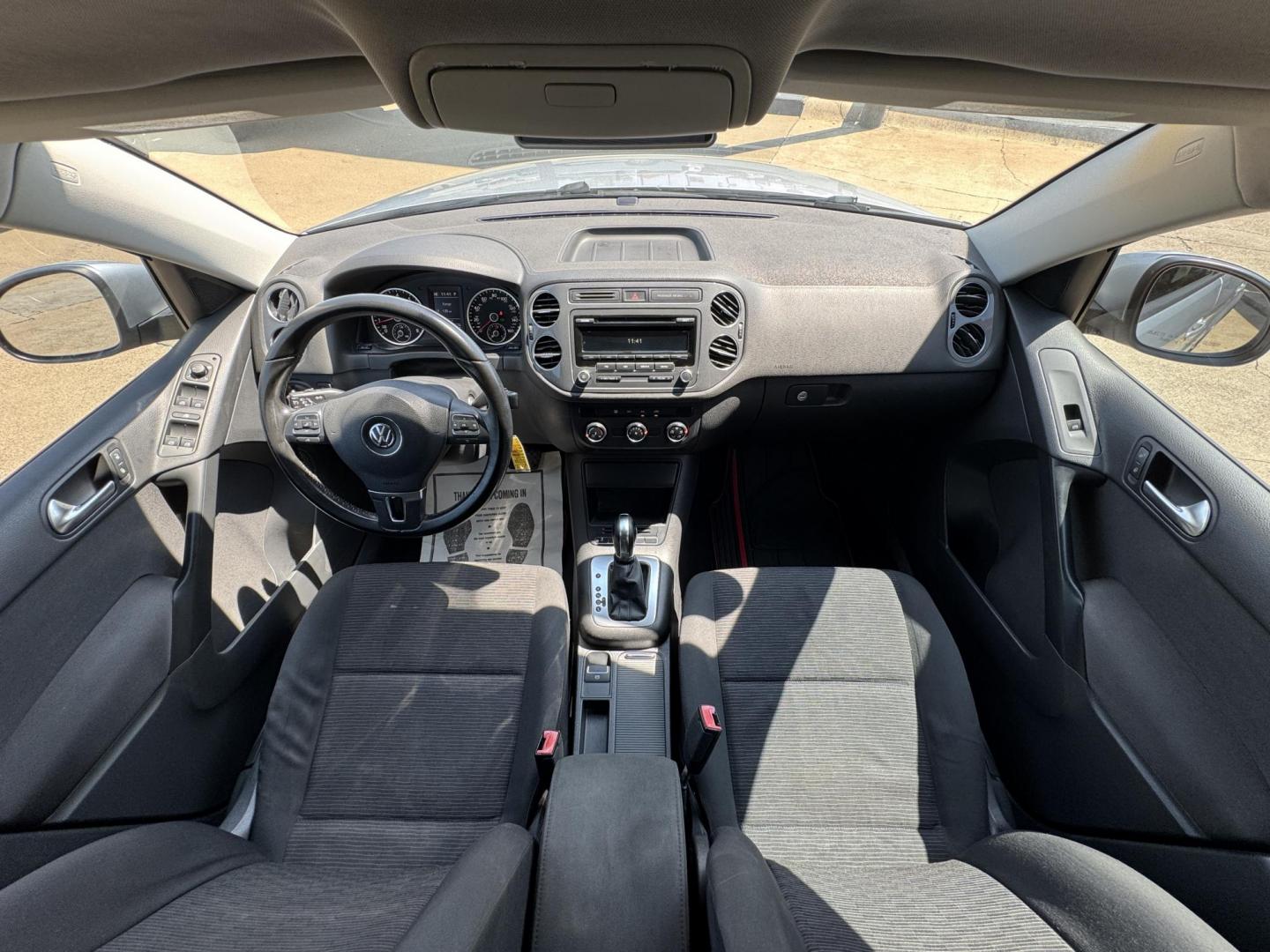 2014 SILVER /BLACK VOLKSWAGEN TIGUAN S; SE; SEL; W S (WVGAV3AX2EW) with an 2.0L Turbocharged 4-Cylinder engine, 6-Speed Automatic transmission, located at 5900 E. Lancaster Ave., Fort Worth, TX, 76112, (817) 457-5456, 0.000000, 0.000000 - Sporty and versatile, this Tiguan features a 2.0L turbocharged engine, seating for 5 passengers, and up to 23.8 cu. ft. of cargo space. Enjoy features like black cloth interior, power locks, ABS, and stability control—a compact SUV with German engineering, efficiency, and comfort all in one. - Photo#17