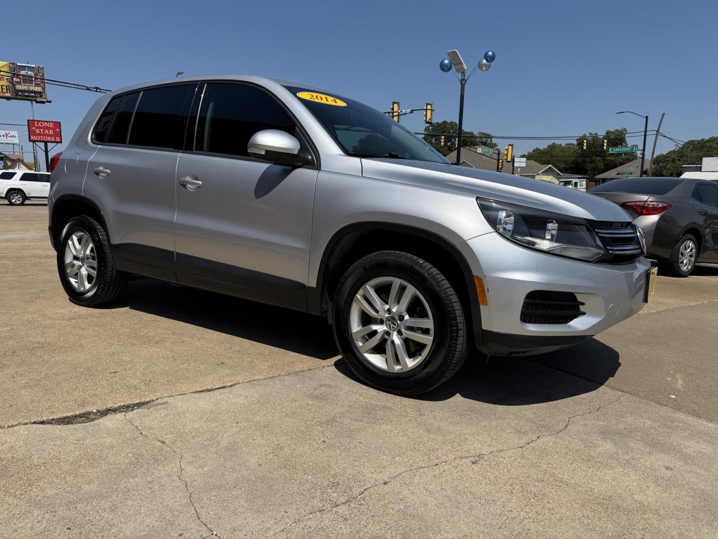 2014 SILVER /BLACK VOLKSWAGEN TIGUAN S; SE; SEL; W S (WVGAV3AX2EW) with an 2.0L Turbocharged 4-Cylinder engine, 6-Speed Automatic transmission, located at 5900 E. Lancaster Ave., Fort Worth, TX, 76112, (817) 457-5456, 0.000000, 0.000000 - Sporty and versatile, this Tiguan features a 2.0L turbocharged engine, seating for 5 passengers, and up to 23.8 cu. ft. of cargo space. Enjoy features like black cloth interior, power locks, ABS, and stability control—a compact SUV with German engineering, efficiency, and comfort all in one. - Photo#2