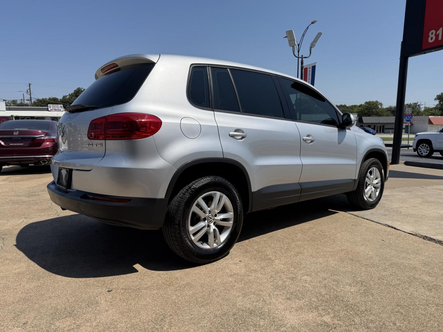 2014 SILVER /BLACK VOLKSWAGEN TIGUAN S; SE; SEL; W S (WVGAV3AX2EW) with an 2.0L Turbocharged 4-Cylinder engine, 6-Speed Automatic transmission, located at 5900 E. Lancaster Ave., Fort Worth, TX, 76112, (817) 457-5456, 0.000000, 0.000000 - Sporty and versatile, this Tiguan features a 2.0L turbocharged engine, seating for 5 passengers, and up to 23.8 cu. ft. of cargo space. Enjoy features like black cloth interior, power locks, ABS, and stability control—a compact SUV with German engineering, efficiency, and comfort all in one. - Photo#3