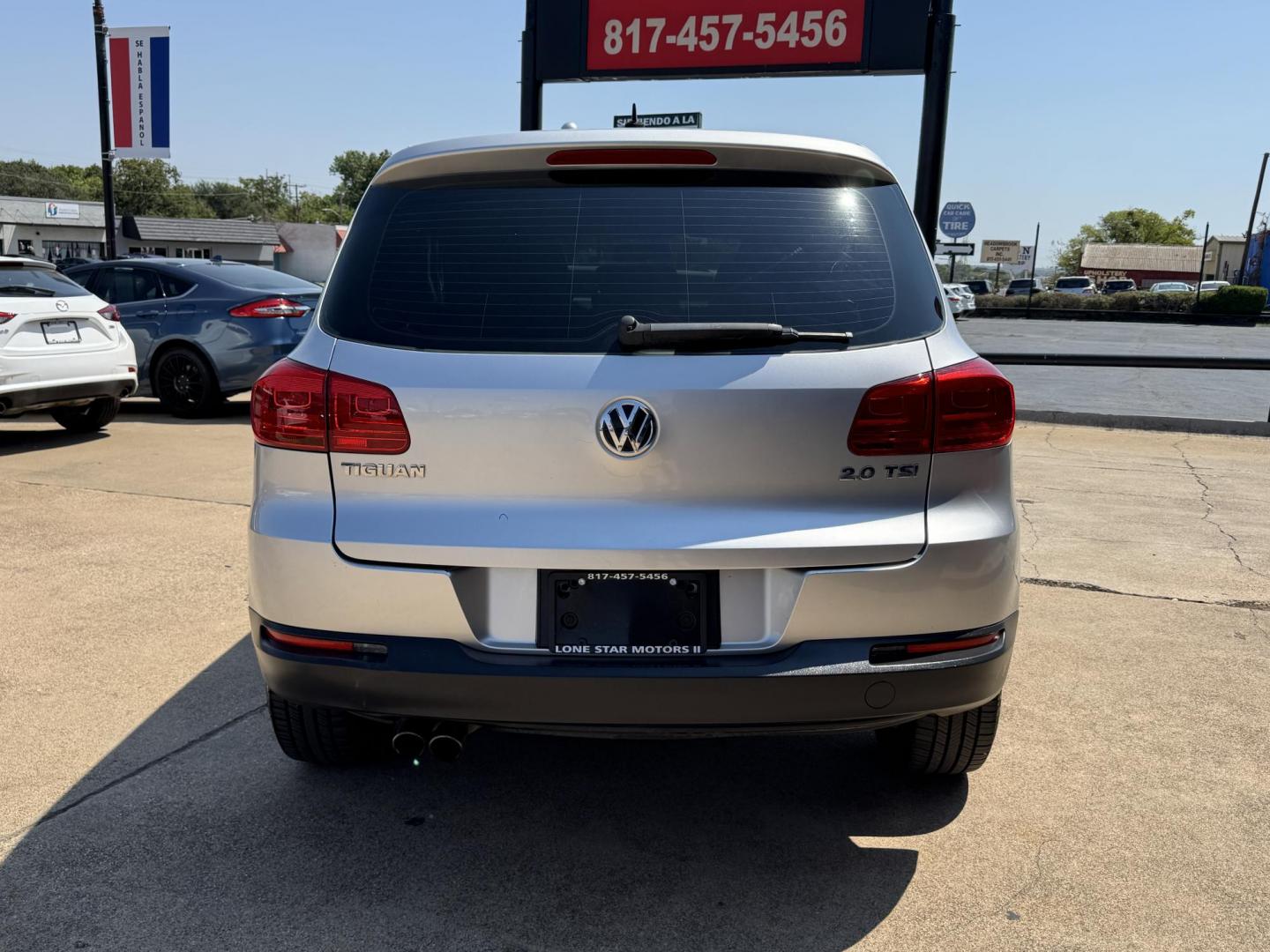 2014 SILVER /BLACK VOLKSWAGEN TIGUAN S; SE; SEL; W S (WVGAV3AX2EW) with an 2.0L Turbocharged 4-Cylinder engine, 6-Speed Automatic transmission, located at 5900 E. Lancaster Ave., Fort Worth, TX, 76112, (817) 457-5456, 0.000000, 0.000000 - Sporty and versatile, this Tiguan features a 2.0L turbocharged engine, seating for 5 passengers, and up to 23.8 cu. ft. of cargo space. Enjoy features like black cloth interior, power locks, ABS, and stability control—a compact SUV with German engineering, efficiency, and comfort all in one. - Photo#4